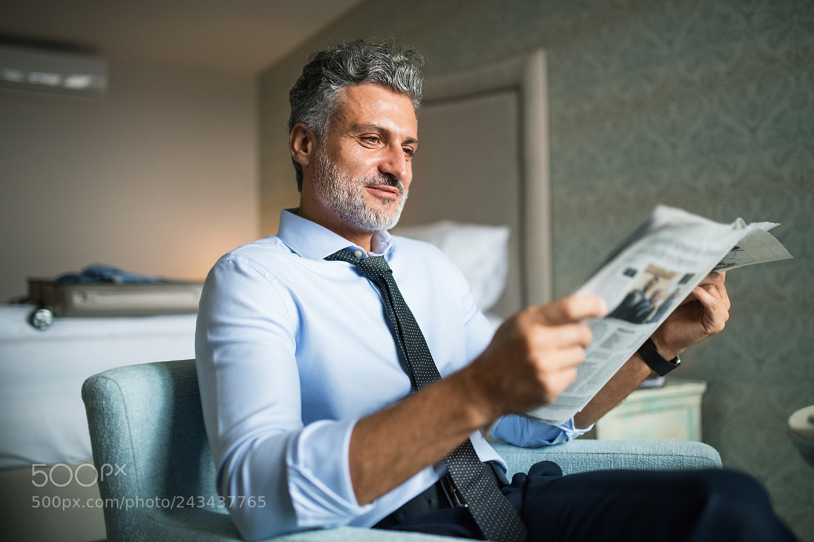 Nikon D5 sample photo. Mature businessman reading newspapers photography