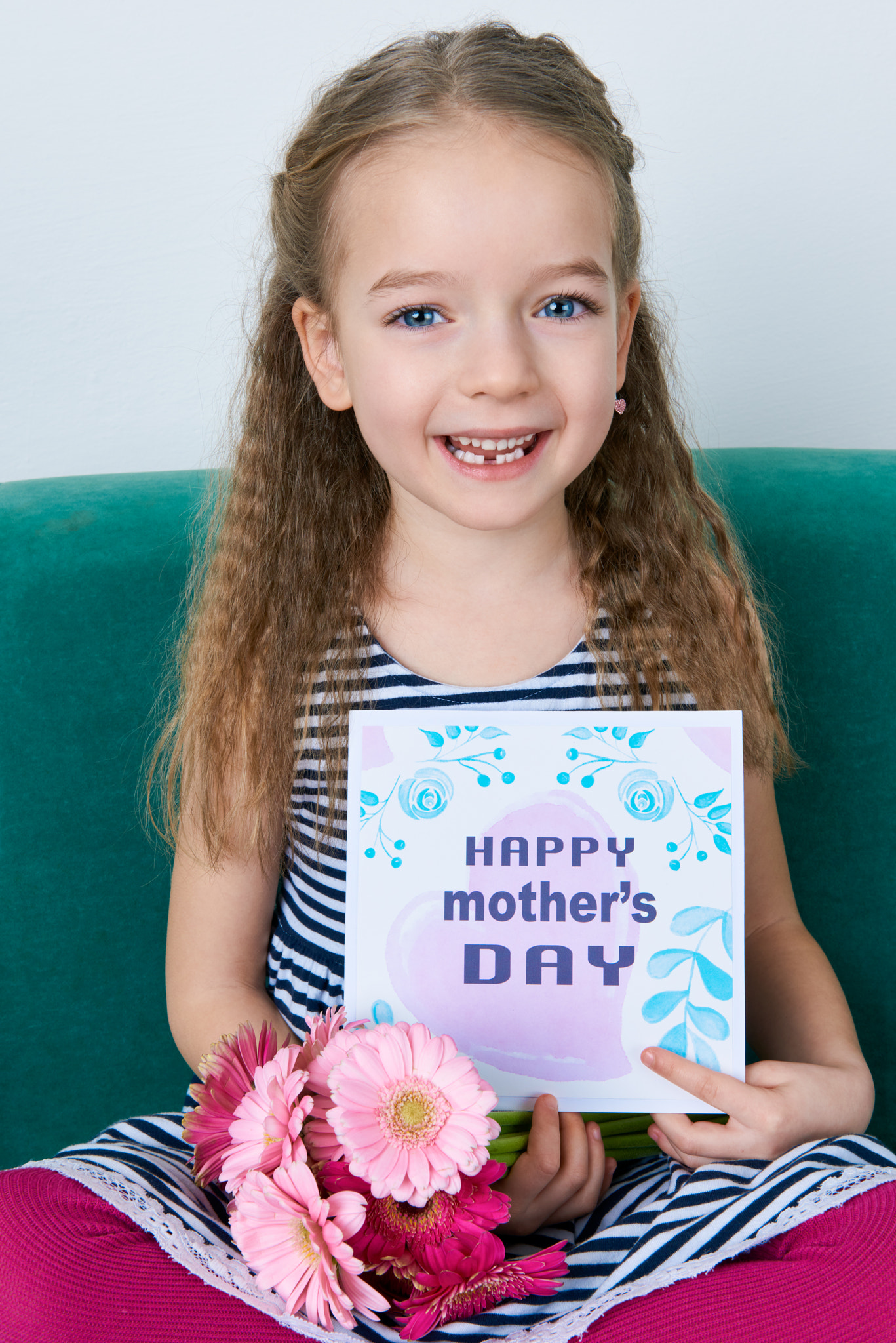 Nikon AF-S Nikkor 24-70mm F2.8G ED sample photo. Adorable young girl sitting on a couch, holding bouquet of pink gerberas and mother's day card.... photography
