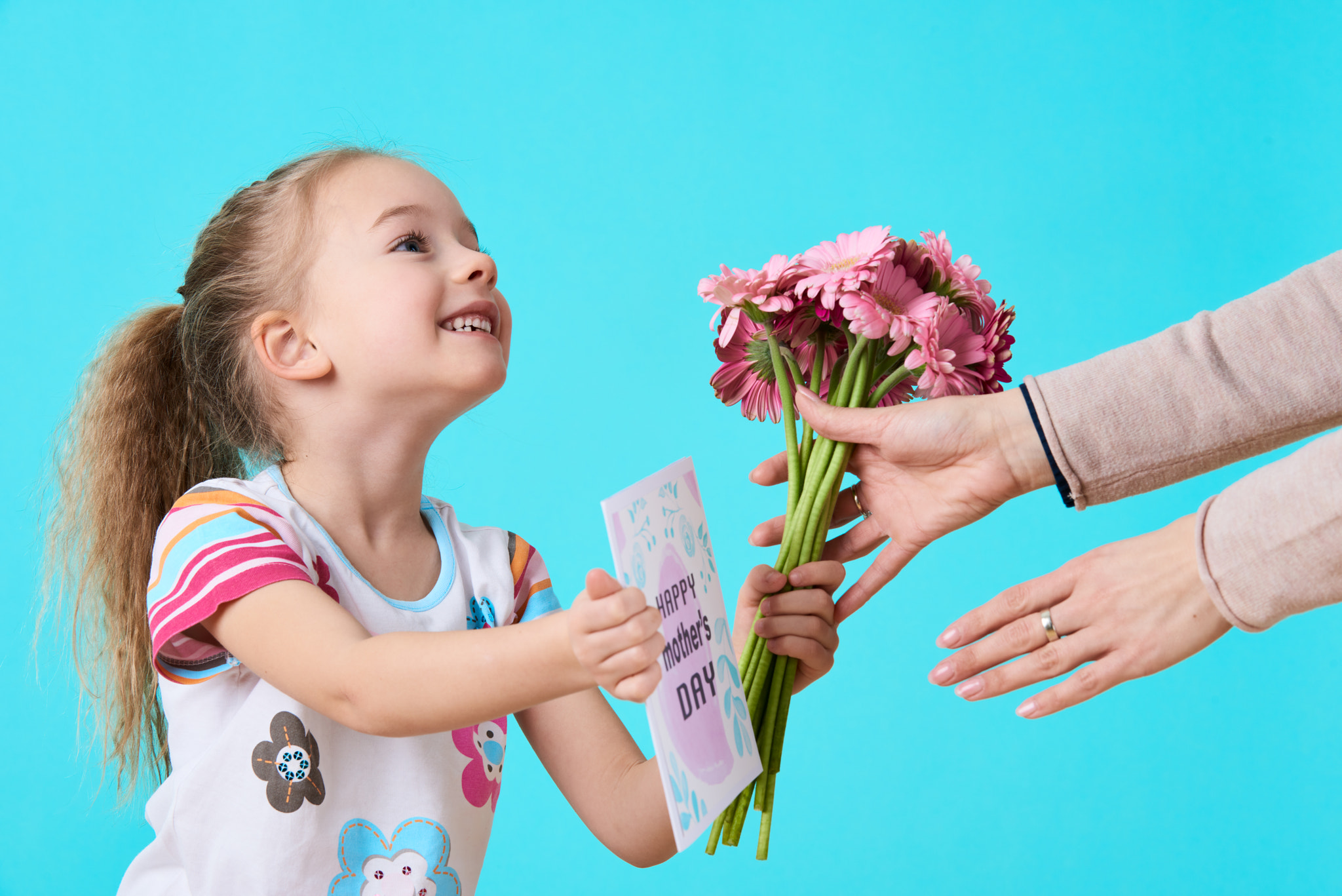 Nikon D810 sample photo. Happy mother's day. cute little girl giving mom greeting card and bouquet of pink gerbera... photography