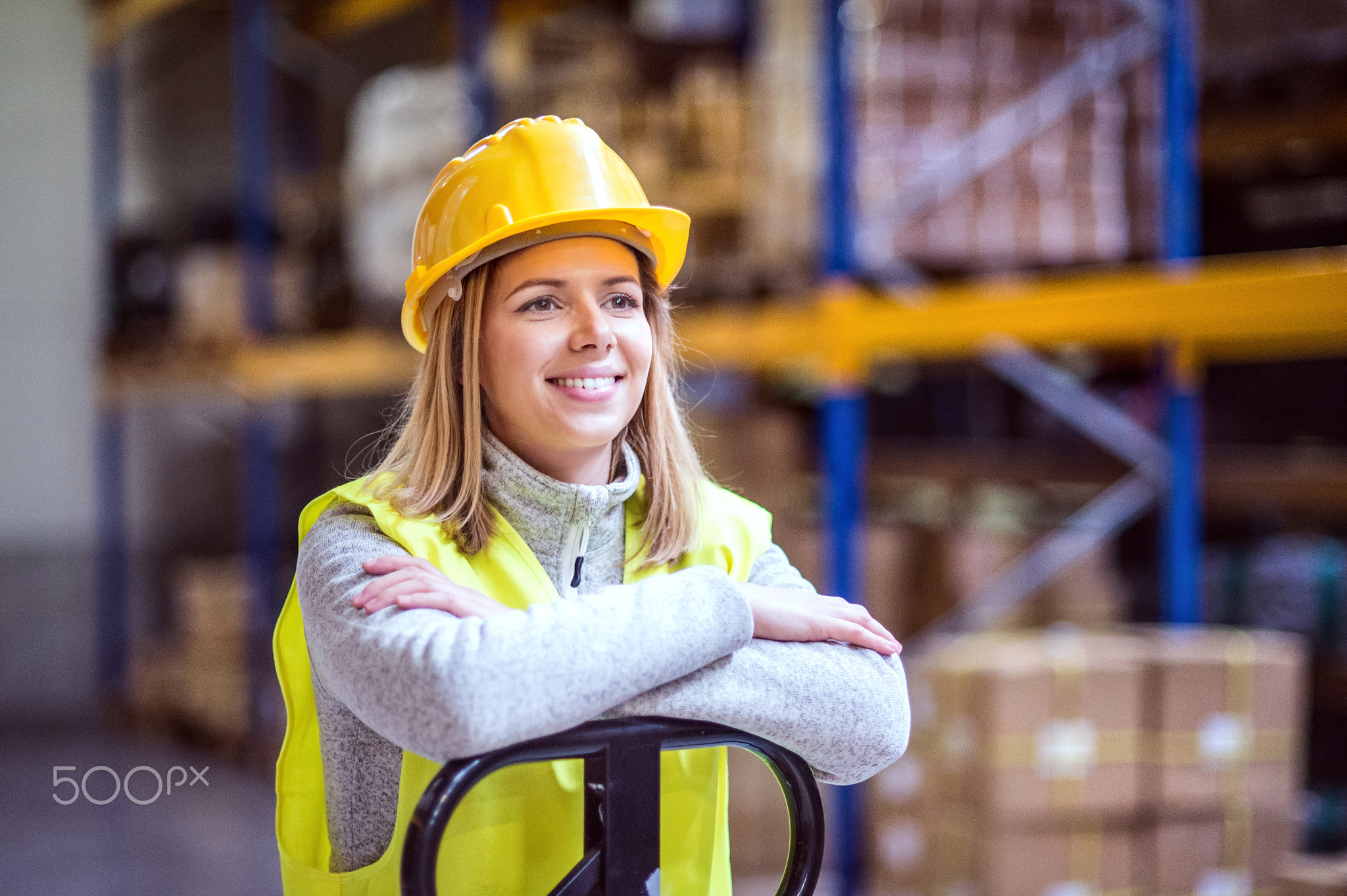 Portrait of a young woman warehouse worker.
