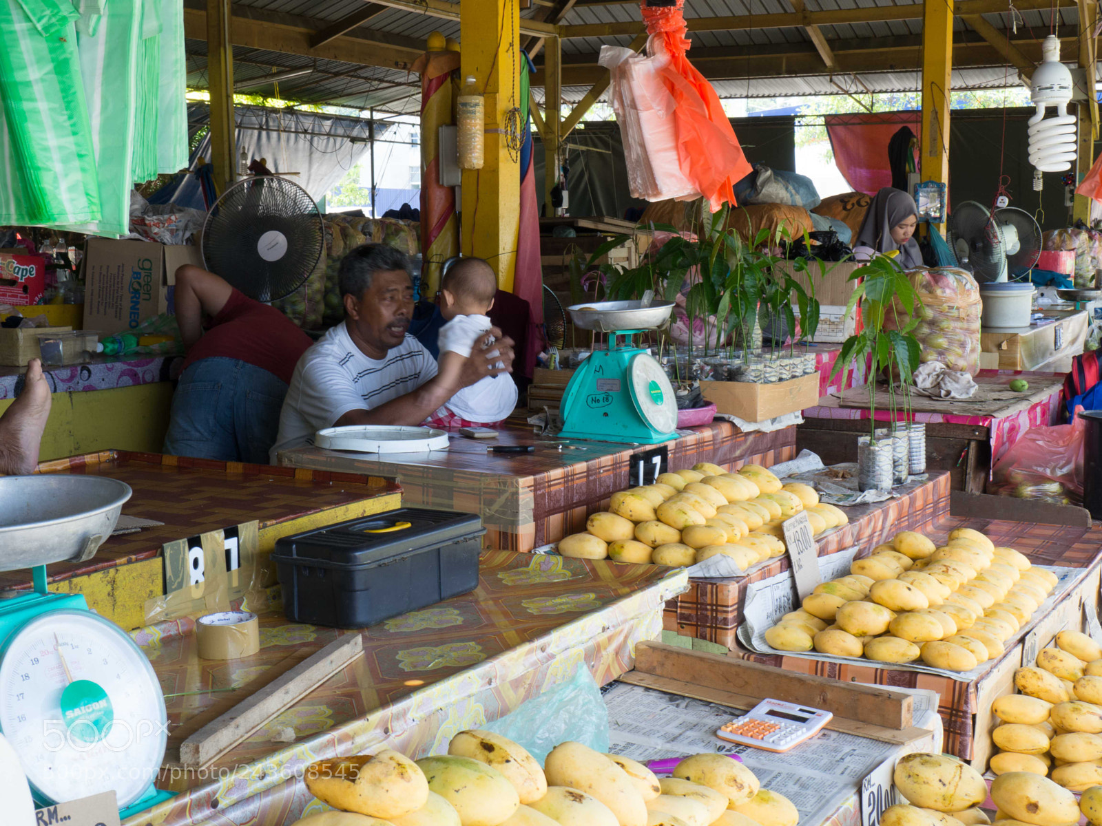 Olympus OM-D E-M10 sample photo. Family at market in photography