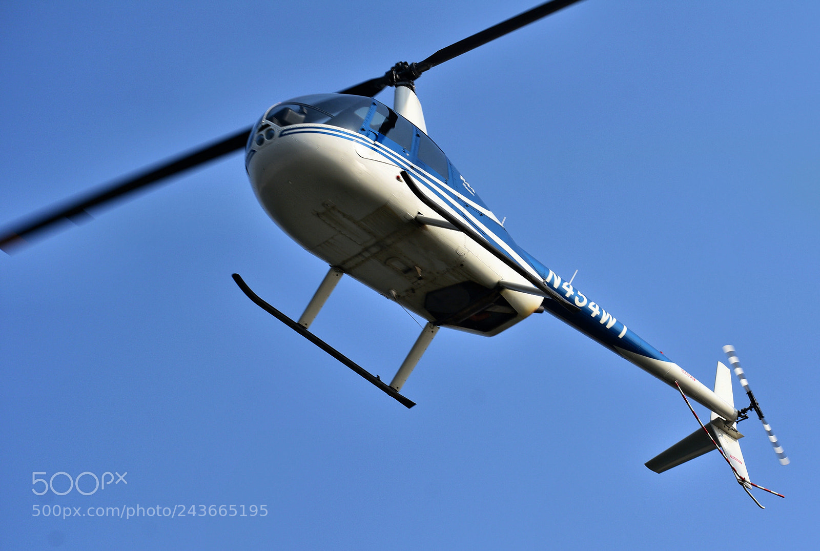 Nikon D7200 sample photo. Helicopter flying across marina photography