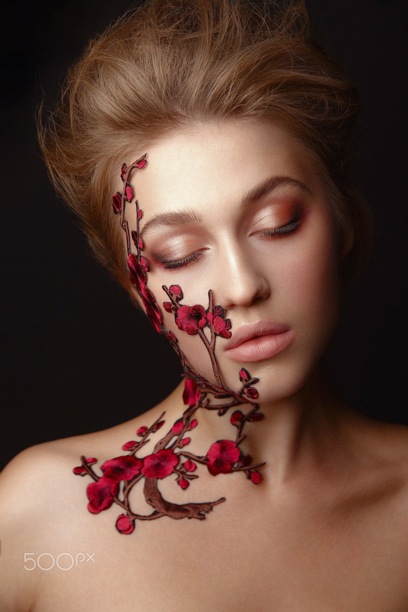 Young woman with flower makeup