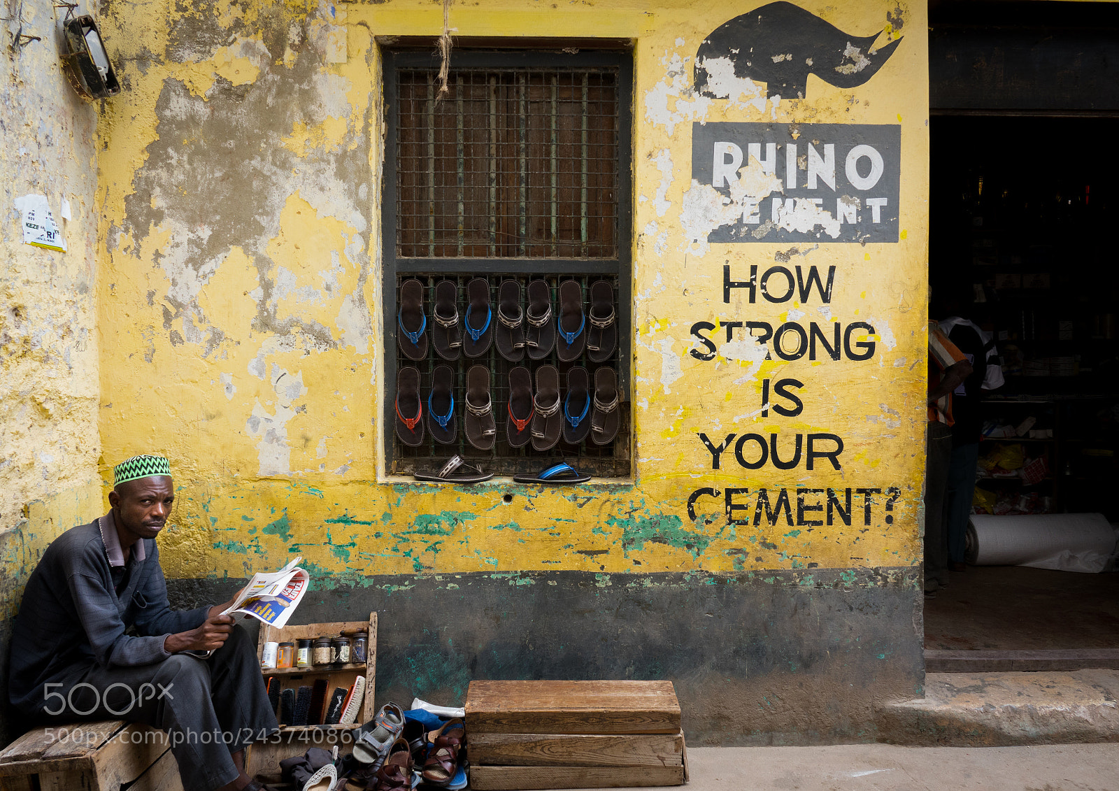 Sony Cyber-shot DSC-RX10 III sample photo. Shoe maker in front photography