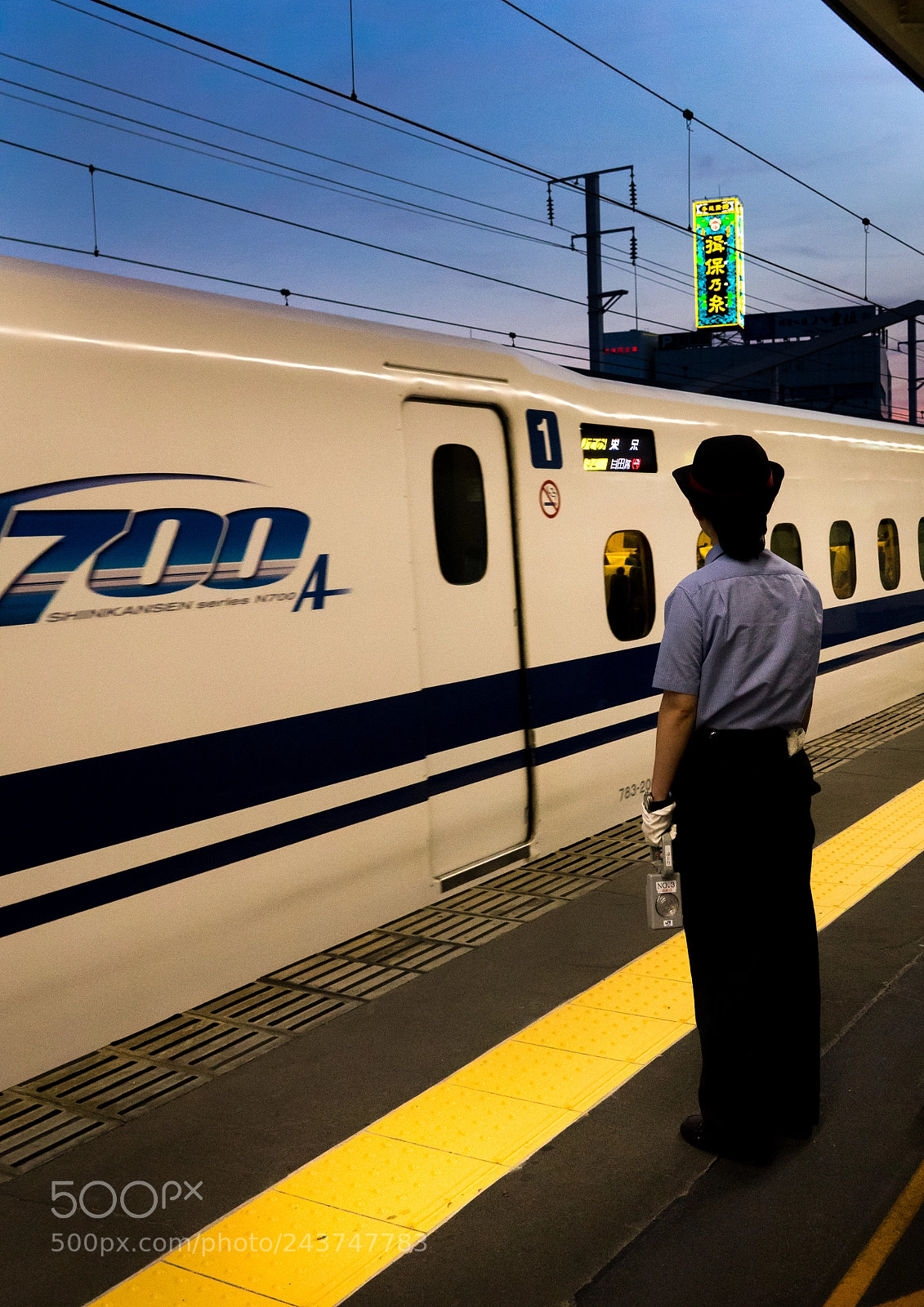 Sony Cyber-shot DSC-RX10 III sample photo. Train guard upon arrival photography