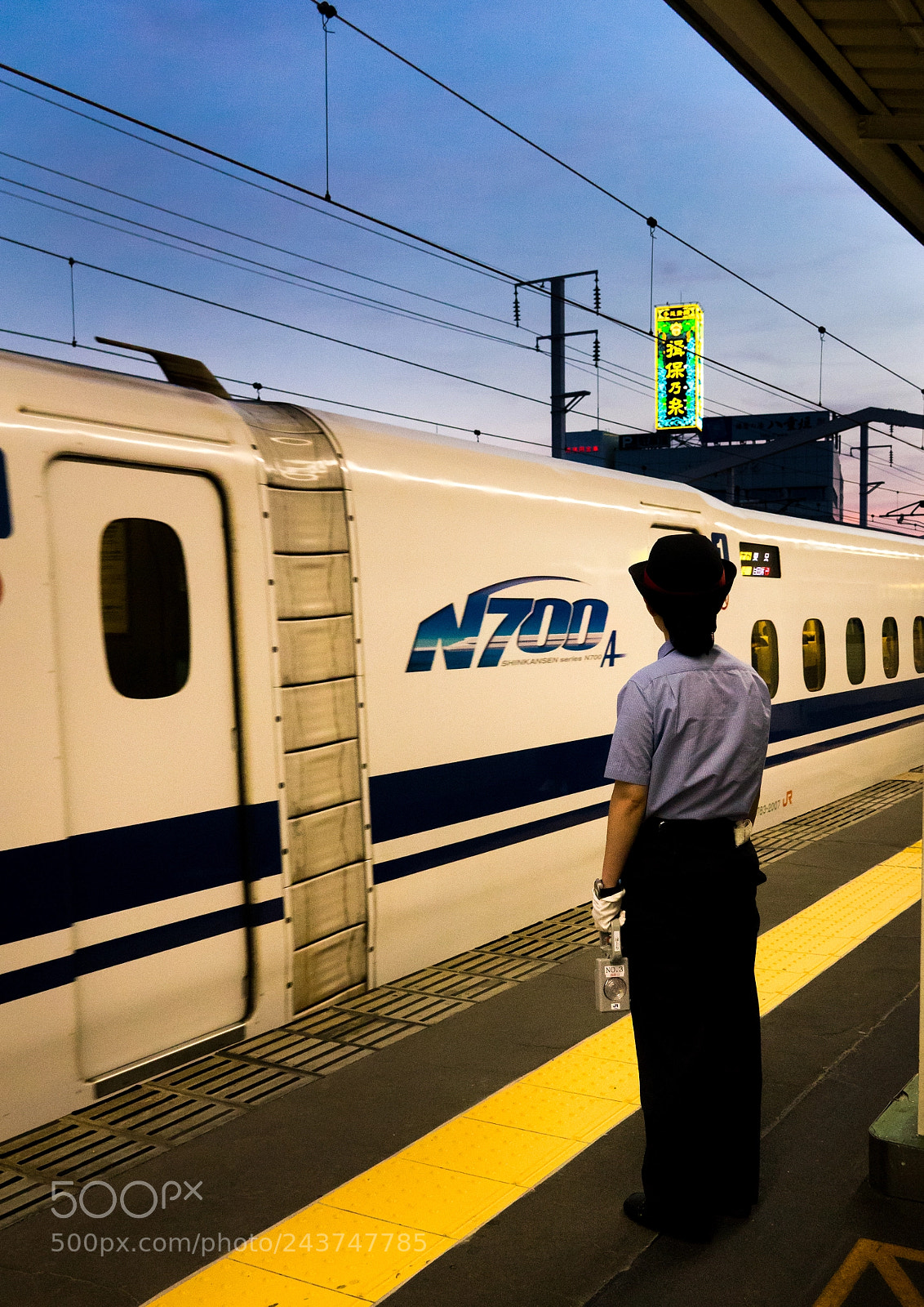 Sony Cyber-shot DSC-RX10 III sample photo. Train guard upon arrival photography