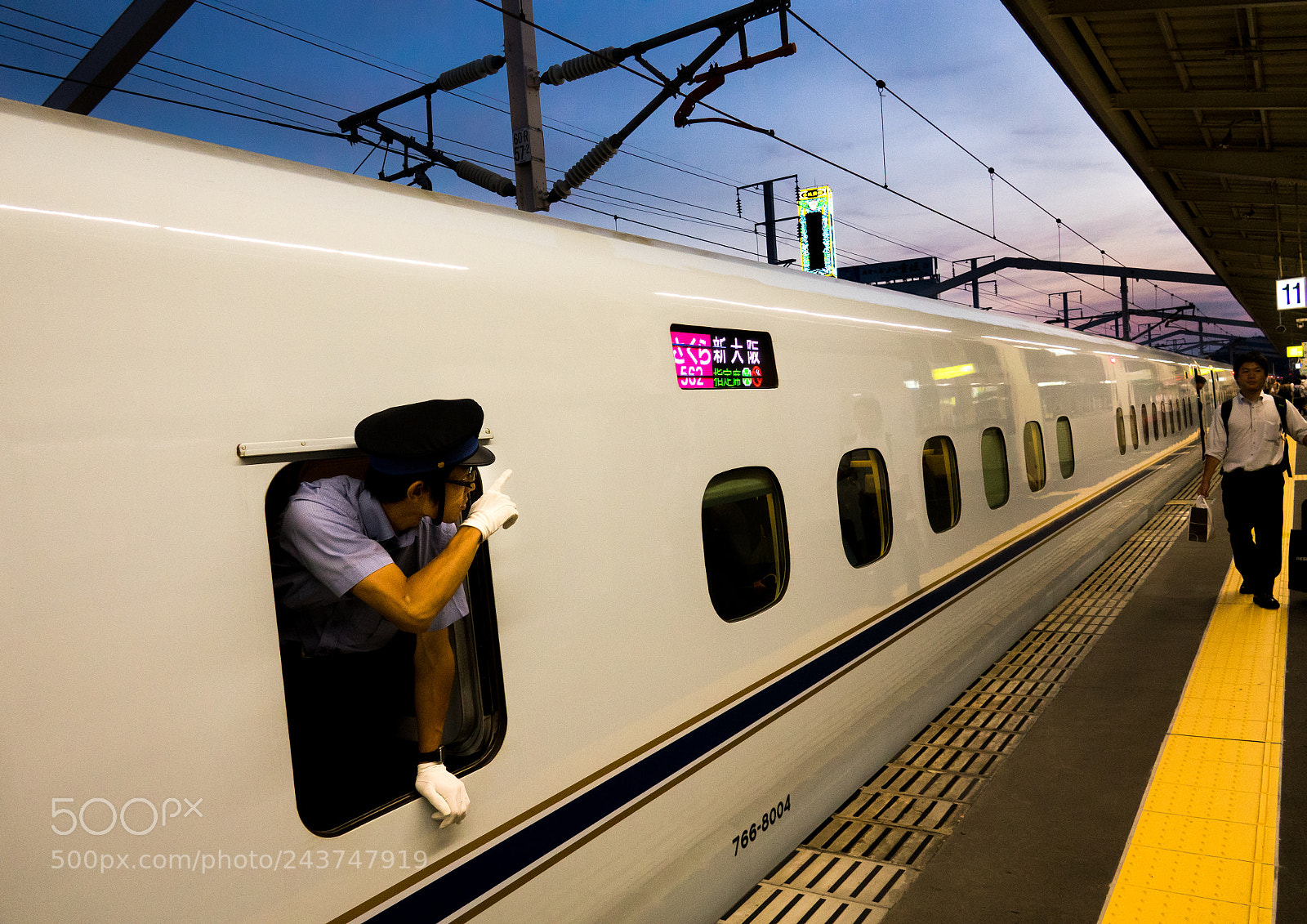 Sony Cyber-shot DSC-RX10 III sample photo. Train conductor by the photography