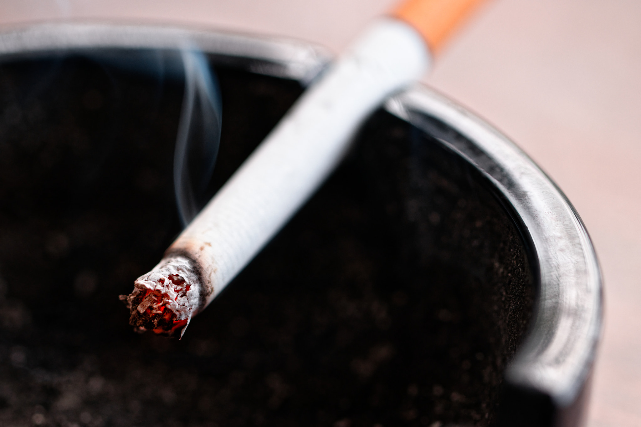 Canon EF 100mm F2.8L Macro IS USM sample photo. Lit cigarette in an ashtray photography