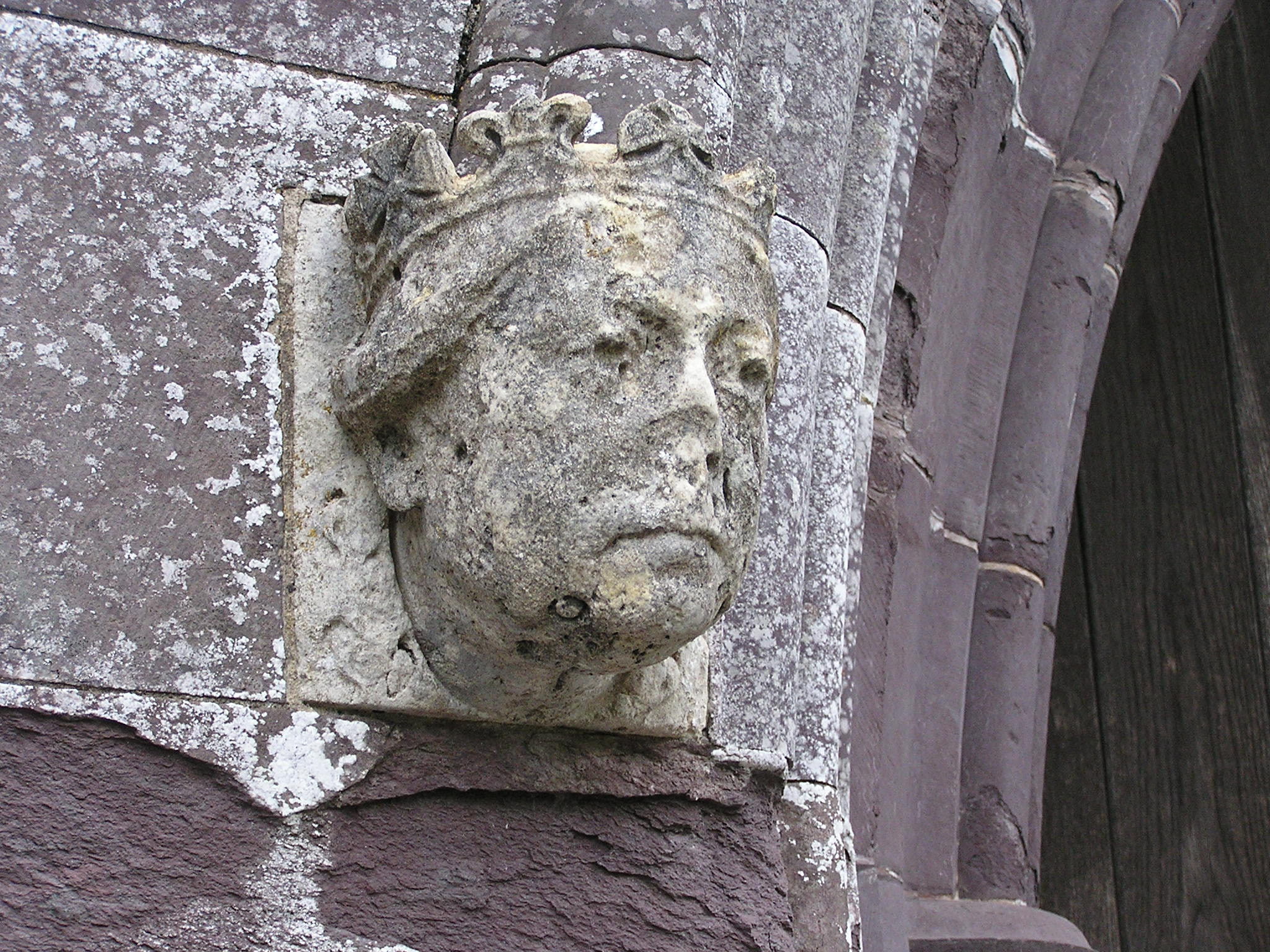 Olympus C740UZ sample photo. Face on a cathedral wall photography