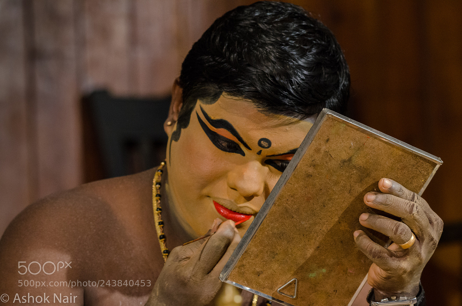 Nikon D5100 sample photo. Kathakali artiste applying make photography