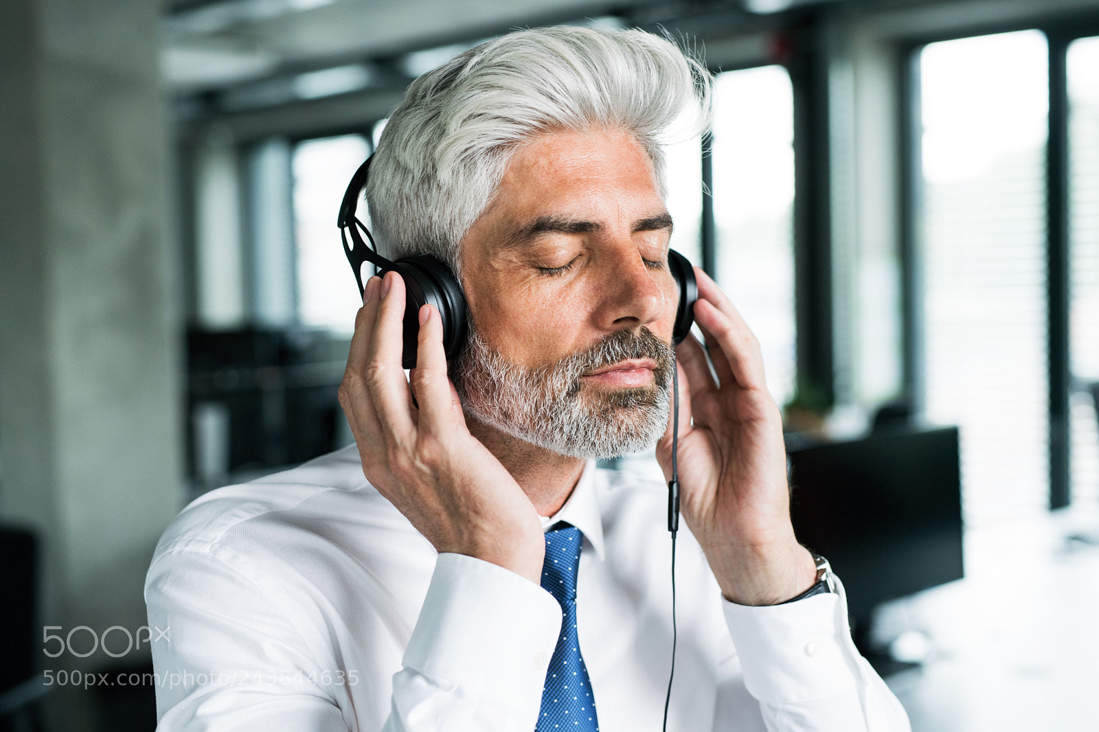 Nikon D5 sample photo. Mature businessman with headphones photography