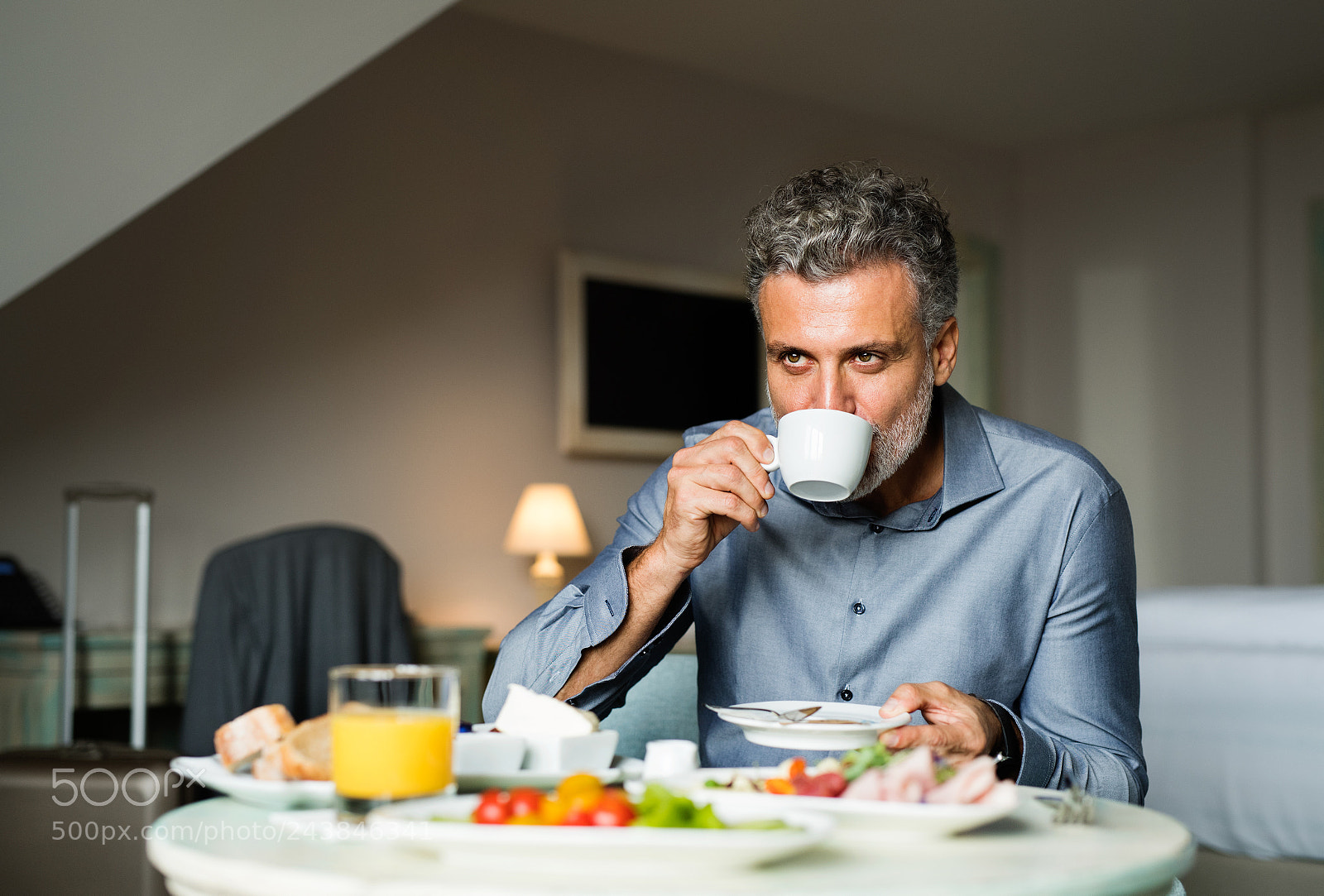 Nikon D5 sample photo. Mature businessman having breakfast photography