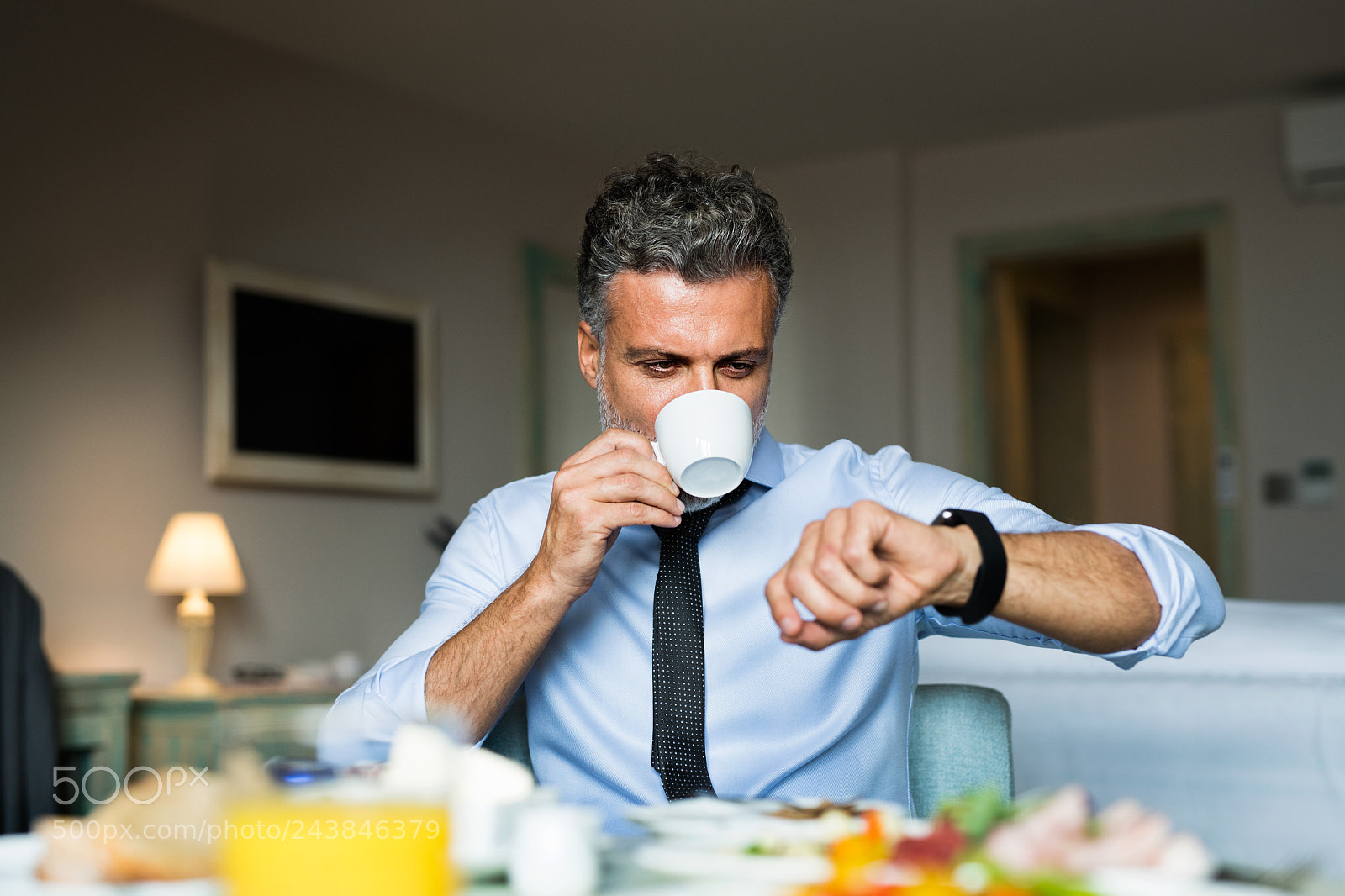 Nikon D5 sample photo. Mature businessman having breakfast photography