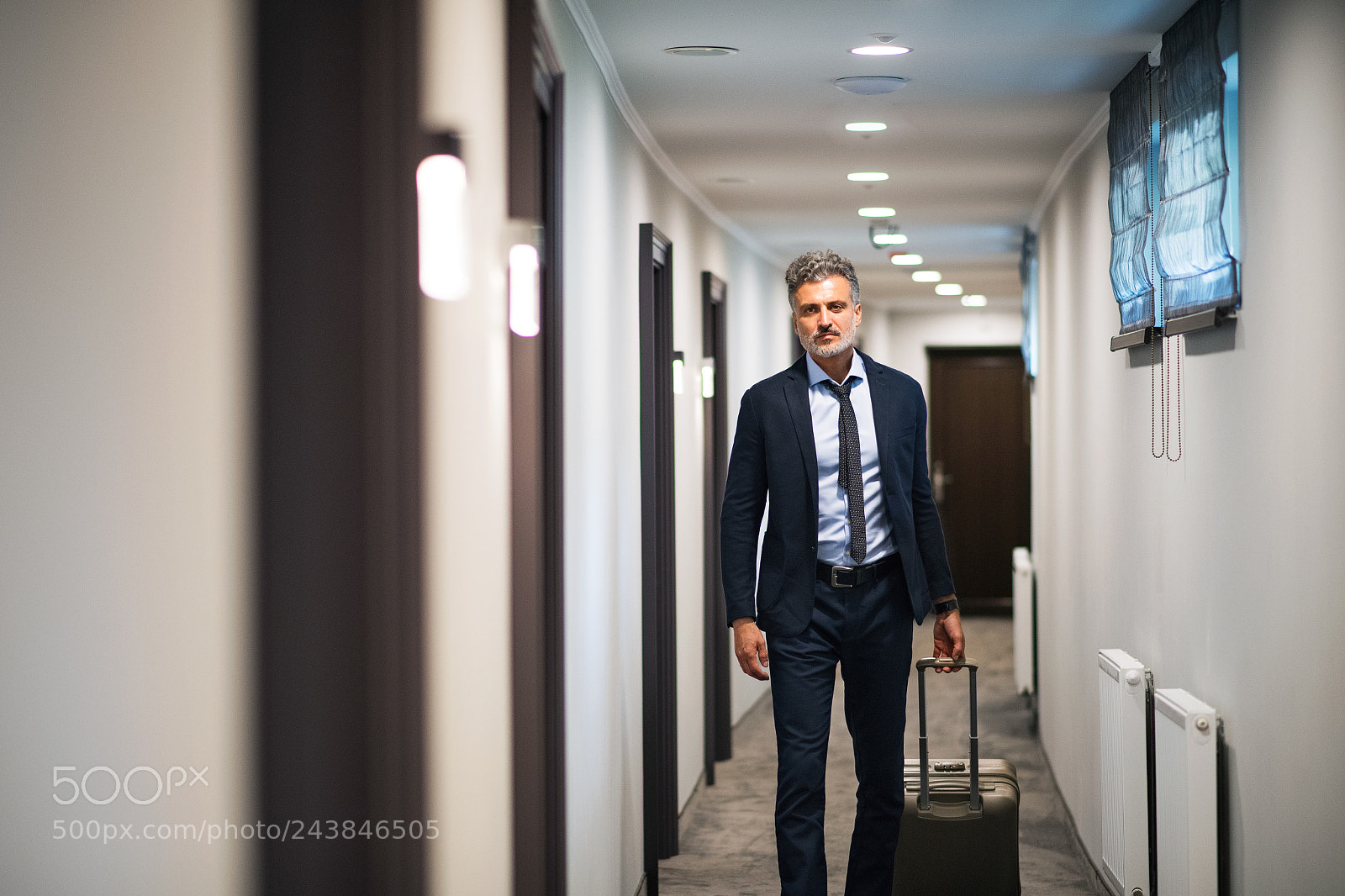 Nikon D5 sample photo. Mature businessman walking with photography