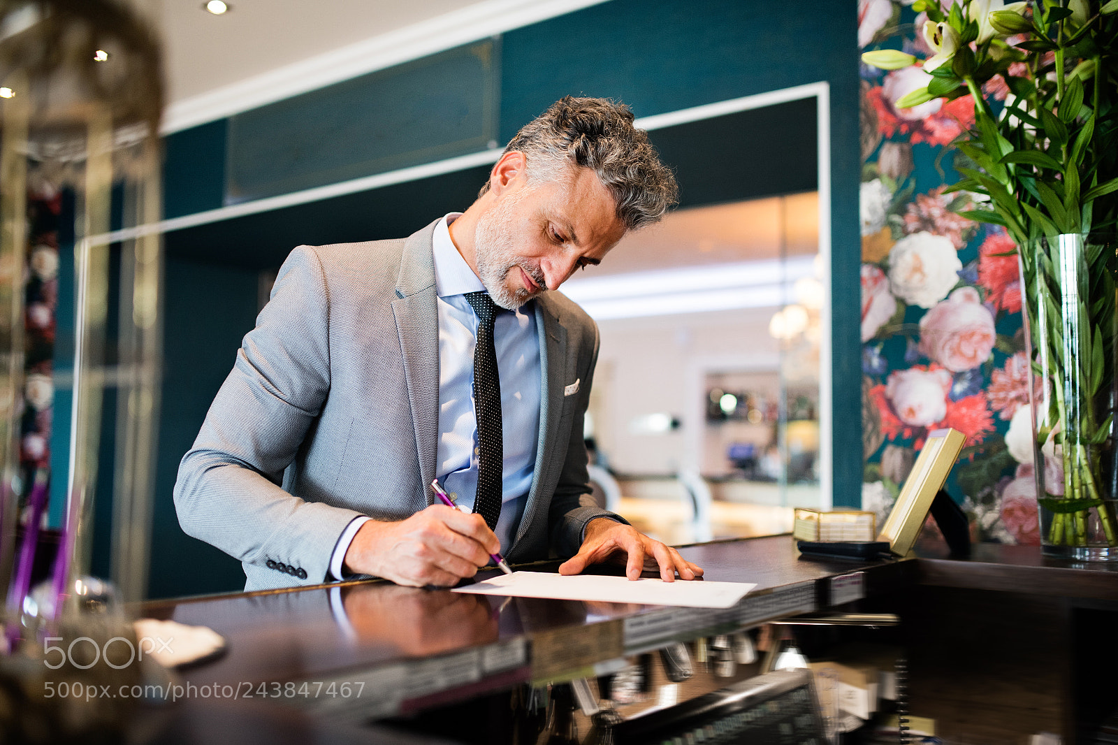 Nikon D5 sample photo. Mature businessman at hotel photography