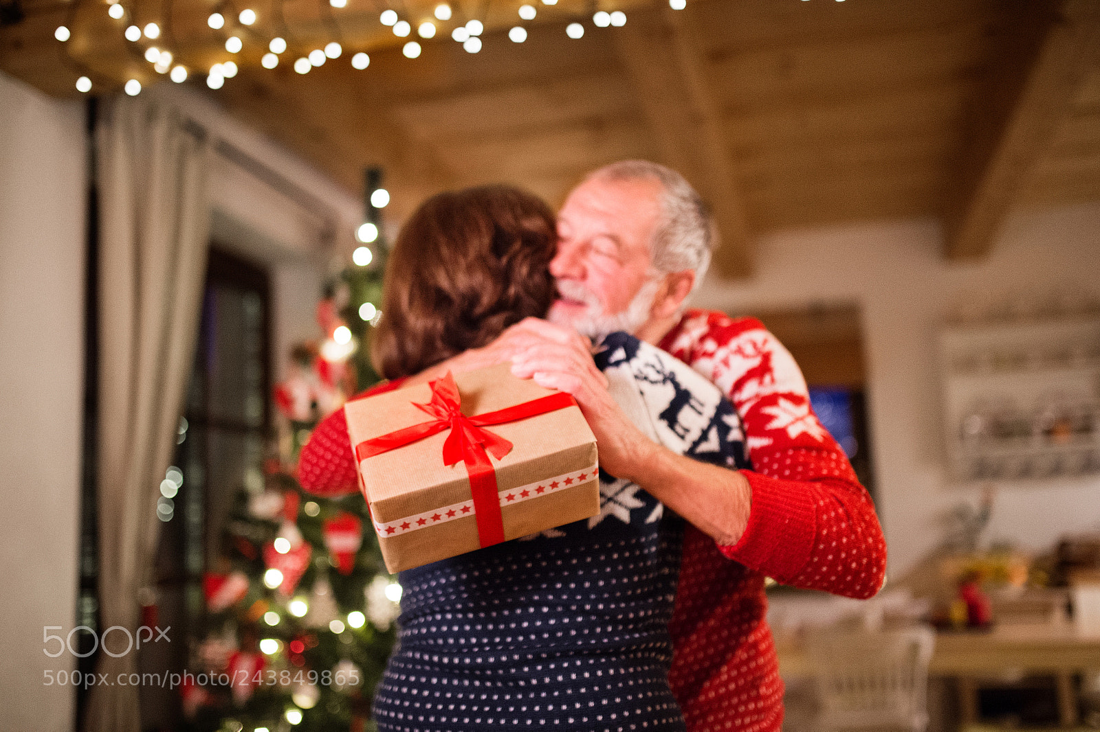 Nikon D4S sample photo. Senior couple exchanging presents photography