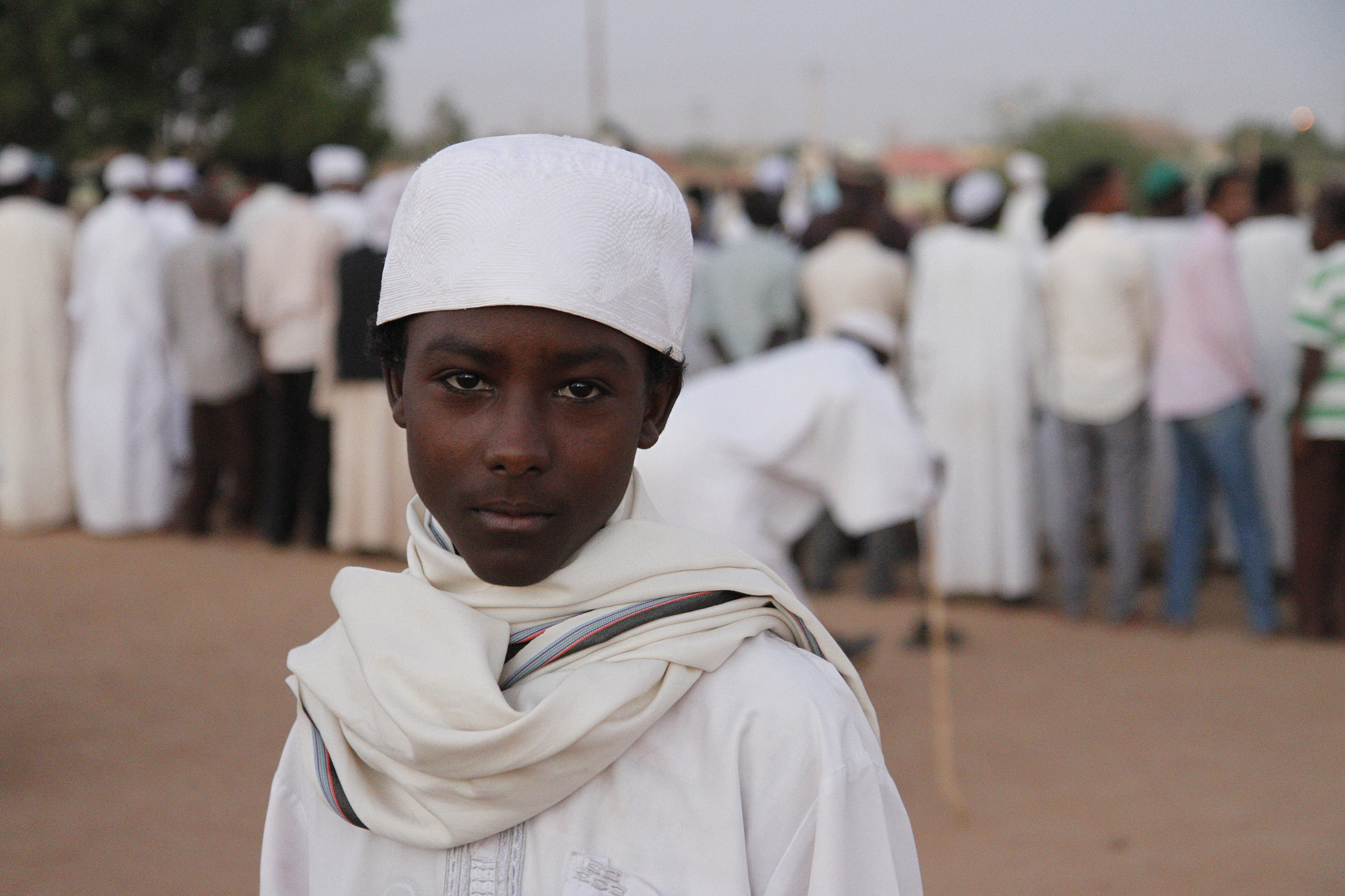 Canon EF-S 17-55mm F2.8 IS USM sample photo. Sudanese boy attending dervish ceremony photography