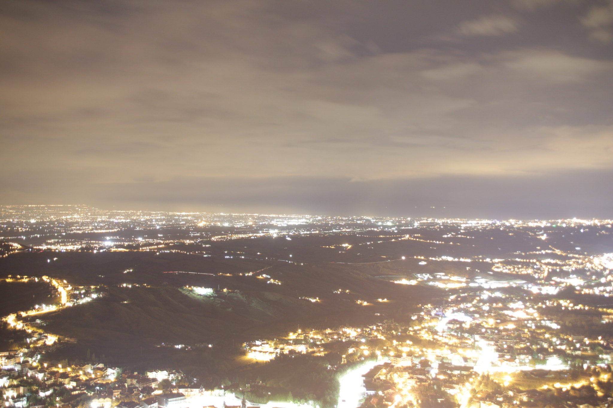 Canon EOS 760D (EOS Rebel T6s / EOS 8000D) + Sigma 18-200mm f/3.5-6.3 DC OS sample photo. Night lights from san marino to rimini photography