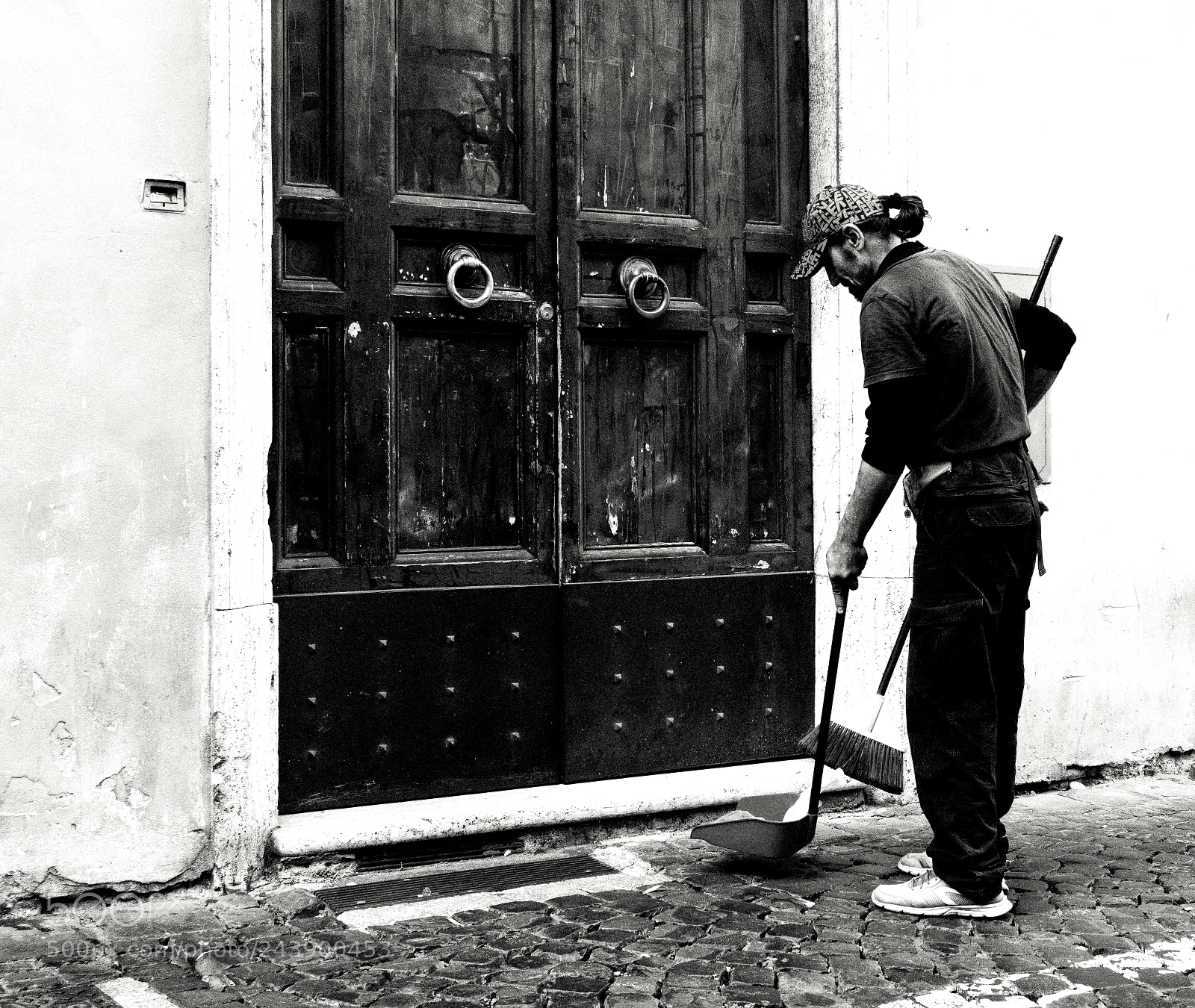 Sony a6500 sample photo. Sweeper by the door photography