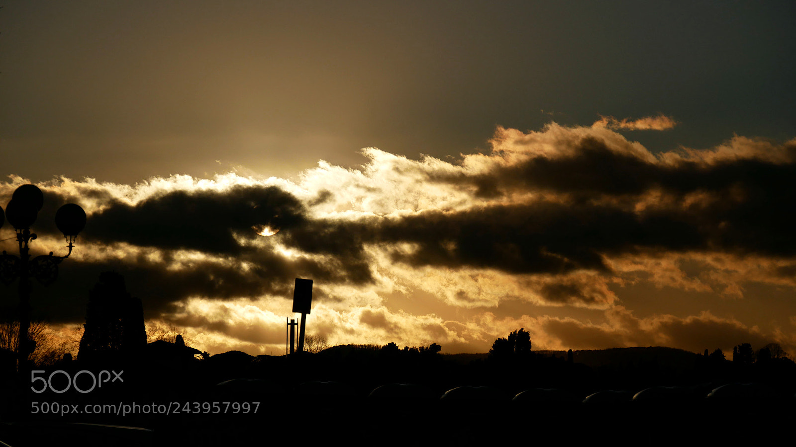Panasonic DMC-G81 sample photo. Sun behind clouds photography