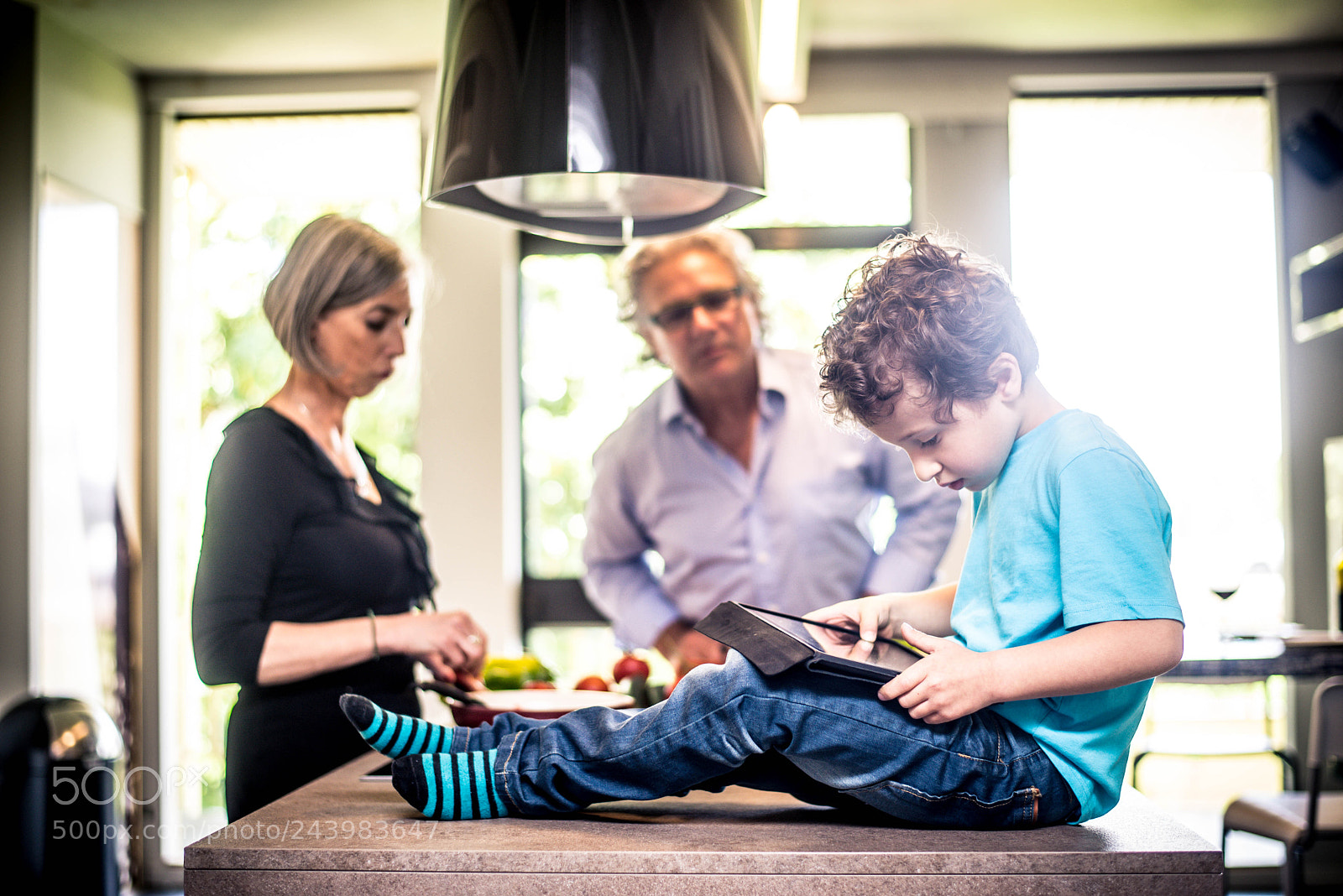 Nikon D610 sample photo. Kid plays with tablet photography