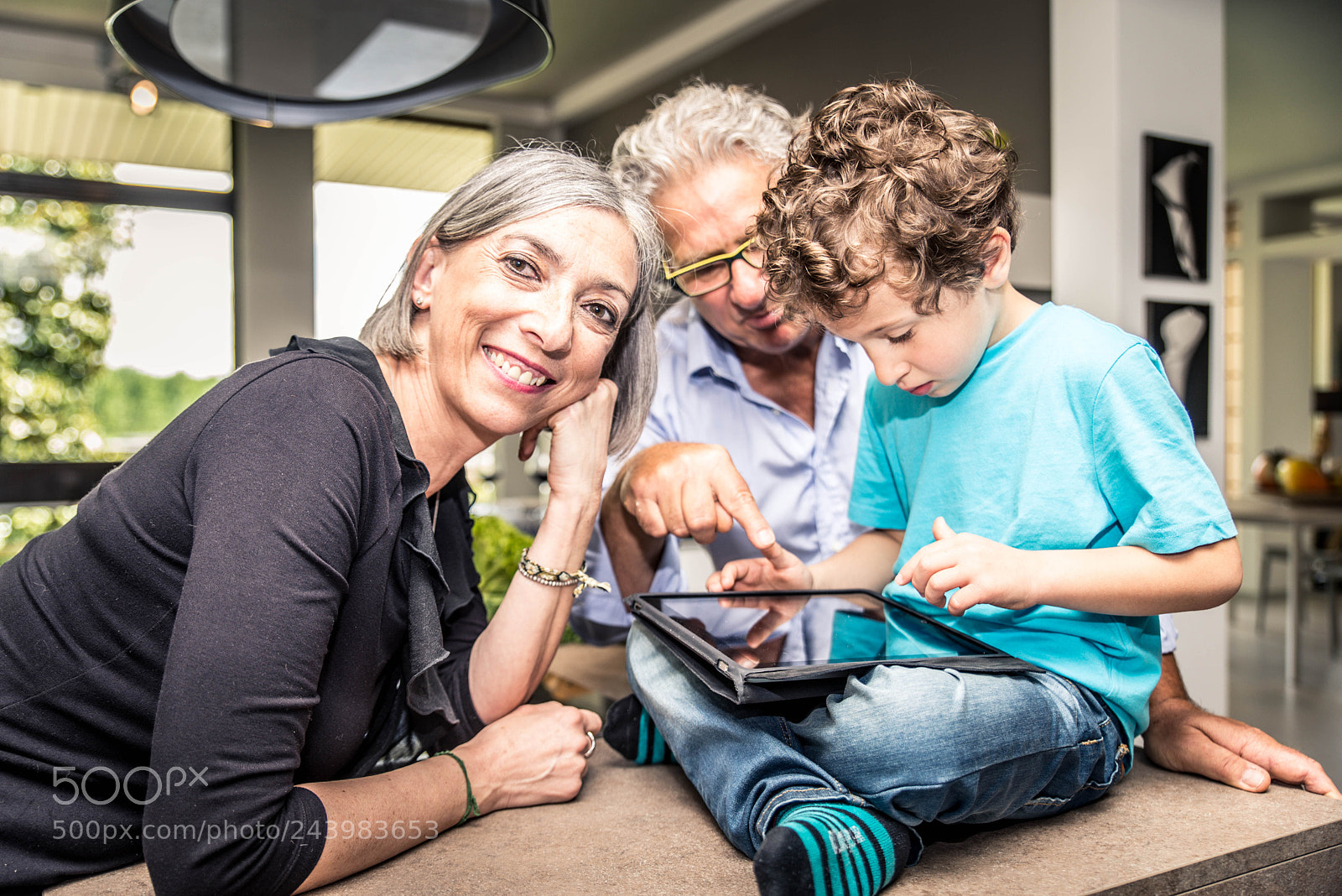 Nikon D610 sample photo. Kid plays with tablet photography