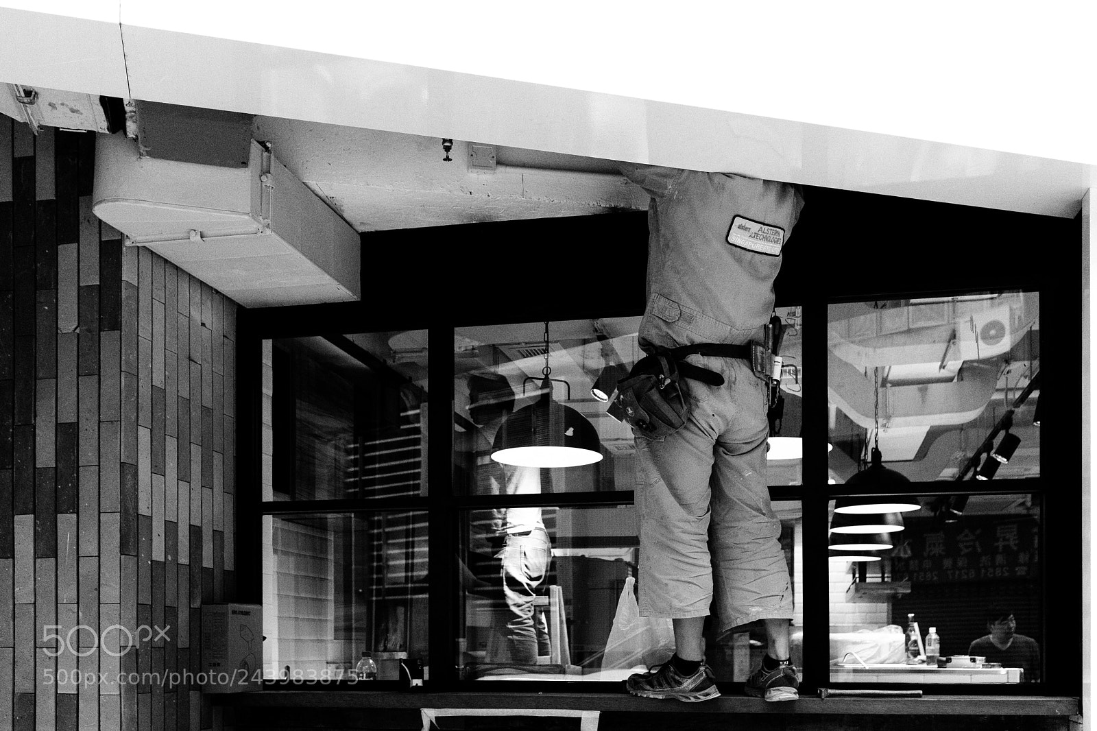 Fujifilm X100F sample photo. Man working overhead photography