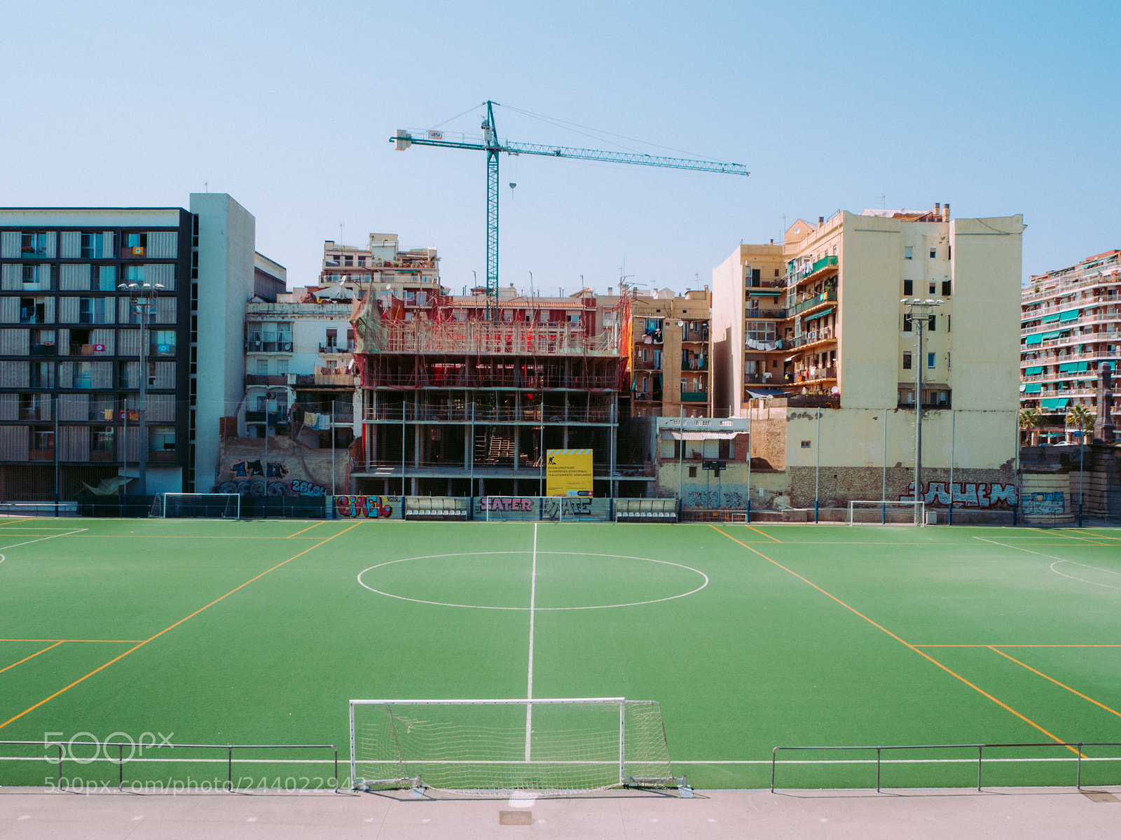Olympus OM-D E-M10 sample photo. Soccer and constructions photography
