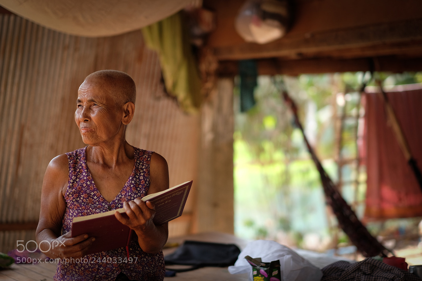 Fujifilm X-T1 sample photo. Budhist elderly women while photography