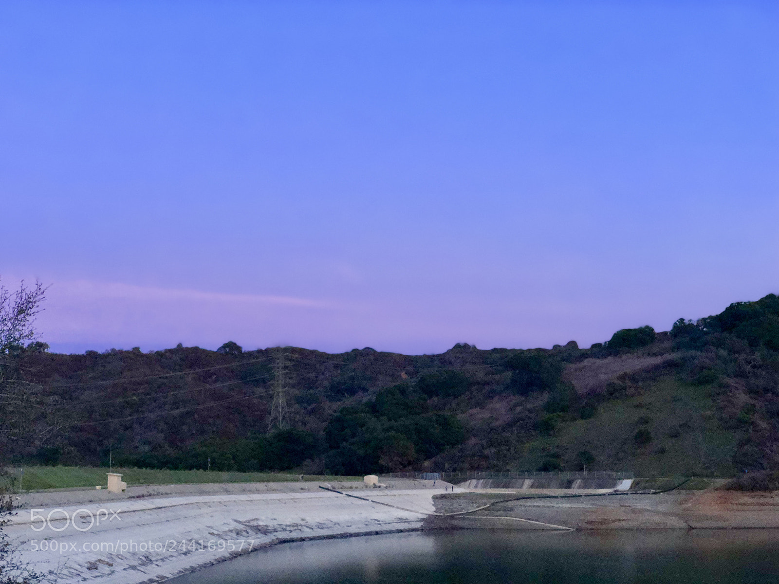 Apple iPhone X sample photo. Setting sky over reservoir photography