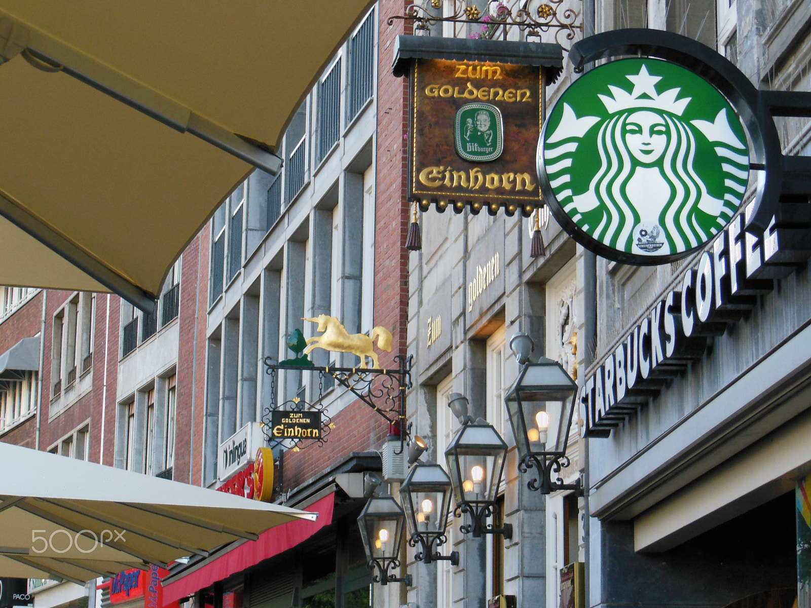 Nikon COOLPIX S9200 sample photo. Old and new--starbucks meets the golden unicorn photography