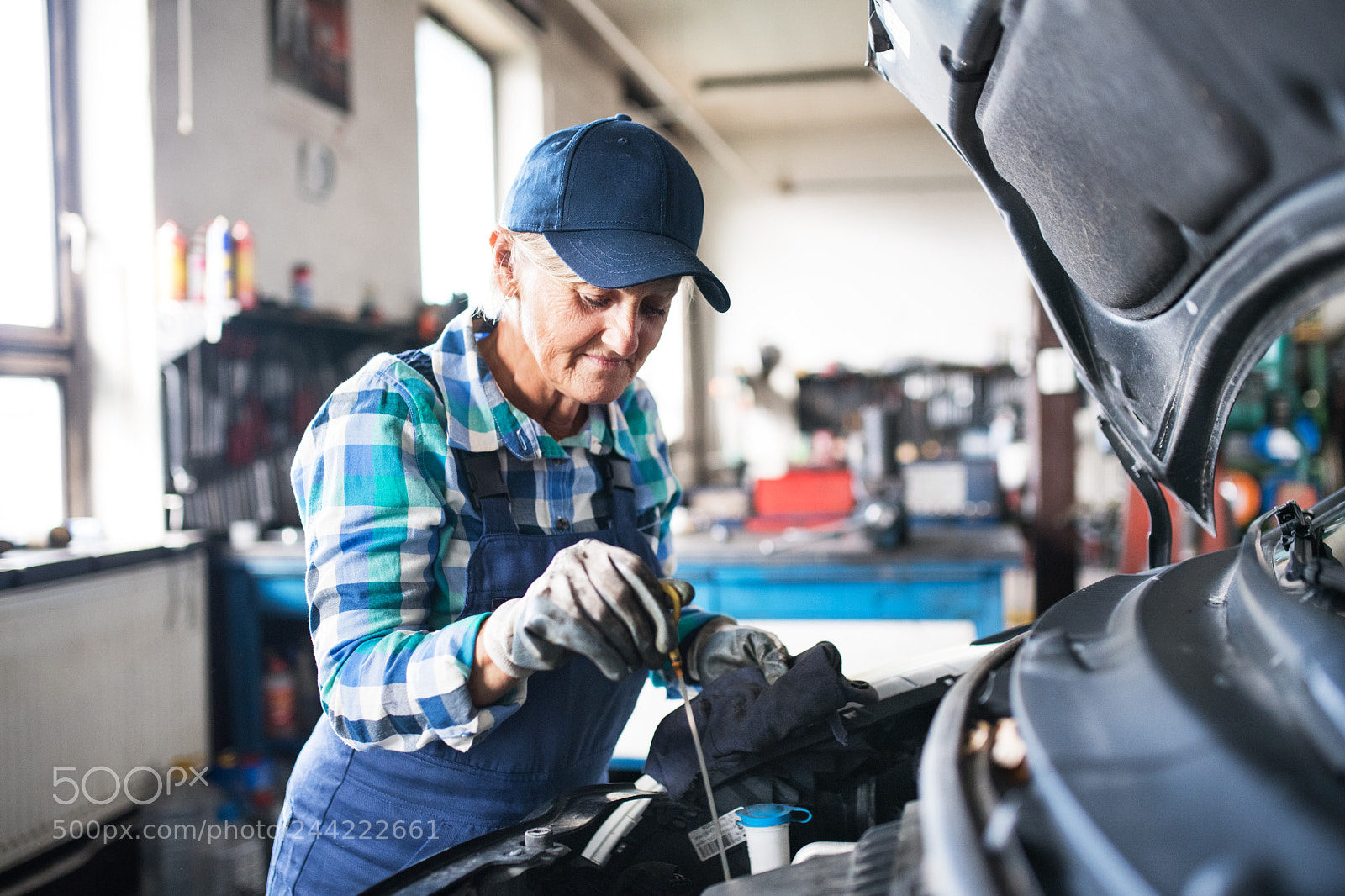 Nikon D5 sample photo. Senior female mechanic repairing photography