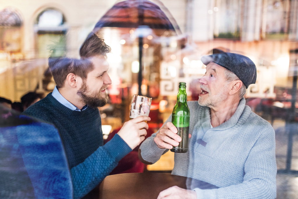 Senior father and his young son in a pub. by Jozef Polc on 500px.com