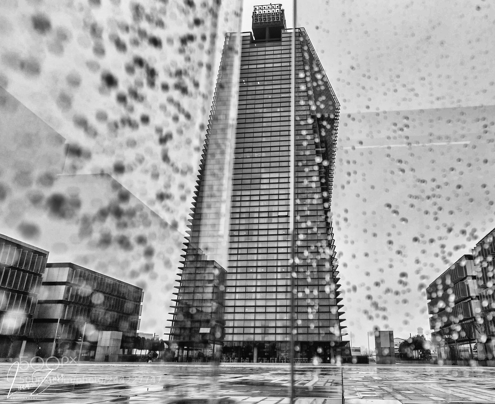 Nikon D3100 sample photo. Skyscraper throw a rainy photography