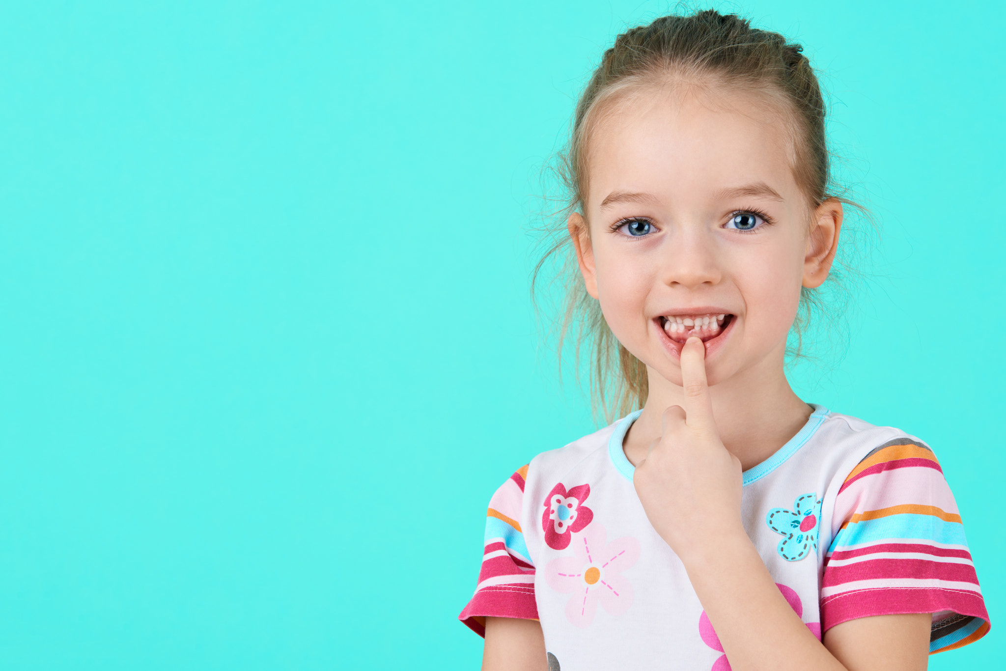 Nikon D810 sample photo. Adorable little girl smiling and showing off her first lost milk tooth. cute preschooler portrait... photography