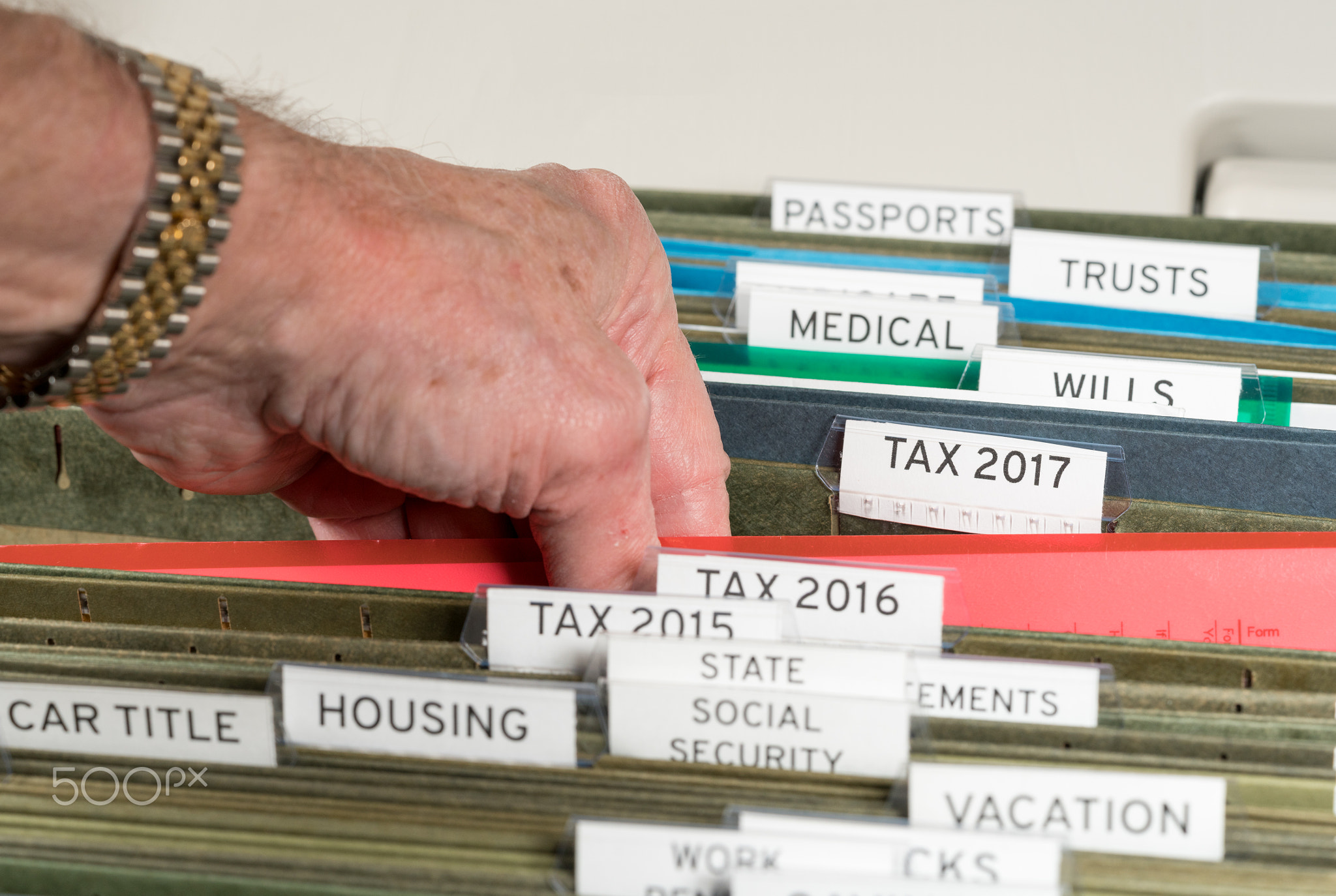 Home filing system for 2017 taxes organized in folders