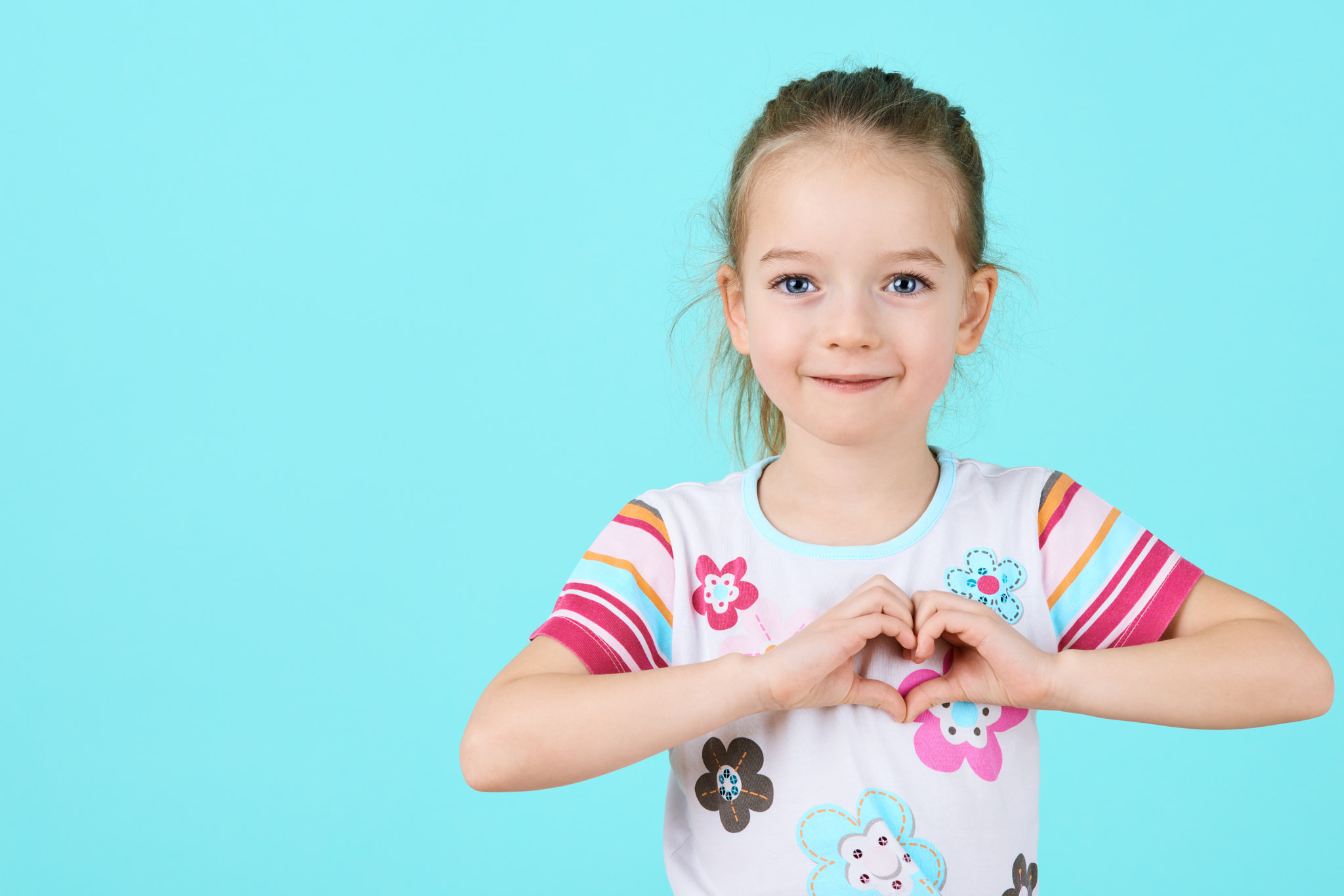 Nikon D810 sample photo. Children, charity, healthcare, adoption concept. smiling little girl making heart-shape gesture... photography