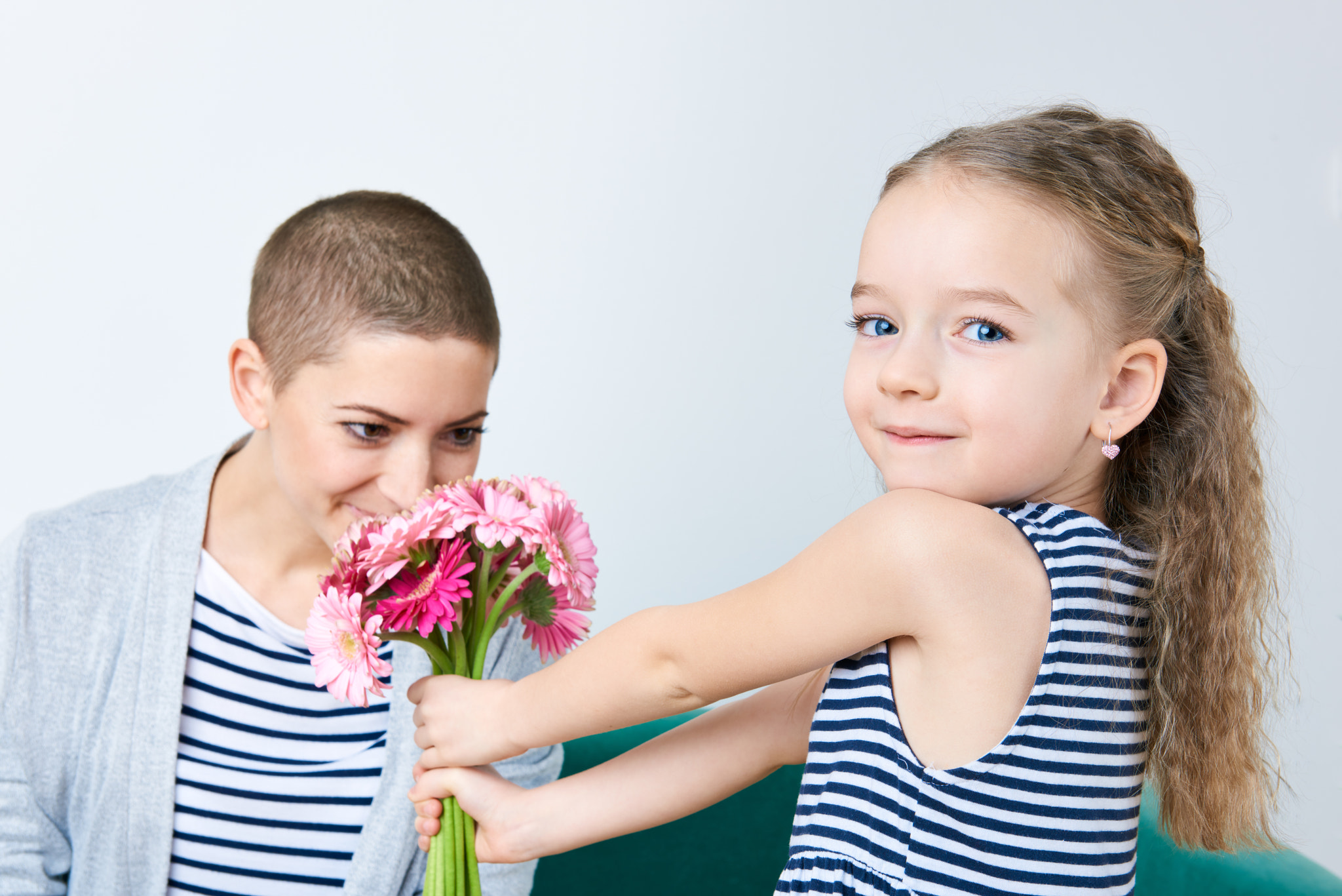 Nikon AF-S Nikkor 24-70mm F2.8G ED sample photo. Happy mother's day, women's day or birthday background. cute little girl giving mom bouquet of... photography