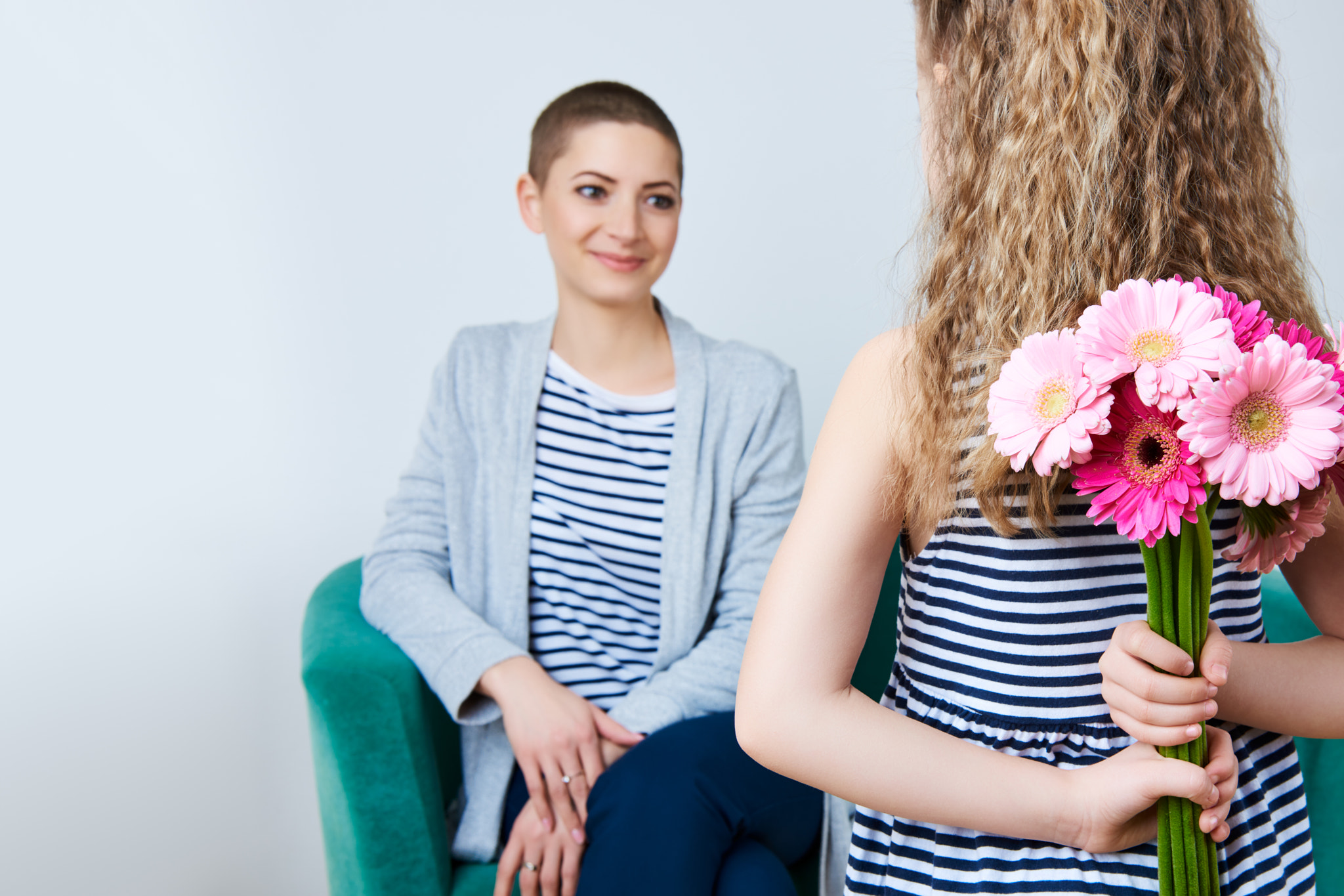 Nikon AF-S Nikkor 24-70mm F2.8G ED sample photo. Happy mother's day, women's day or birthday. cute little girl giving mom bouquet of pink gerbera... photography