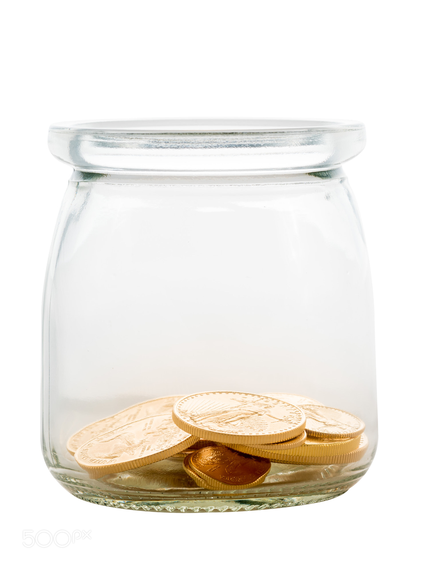 Gold coins inside glass jar to represent savings or investments