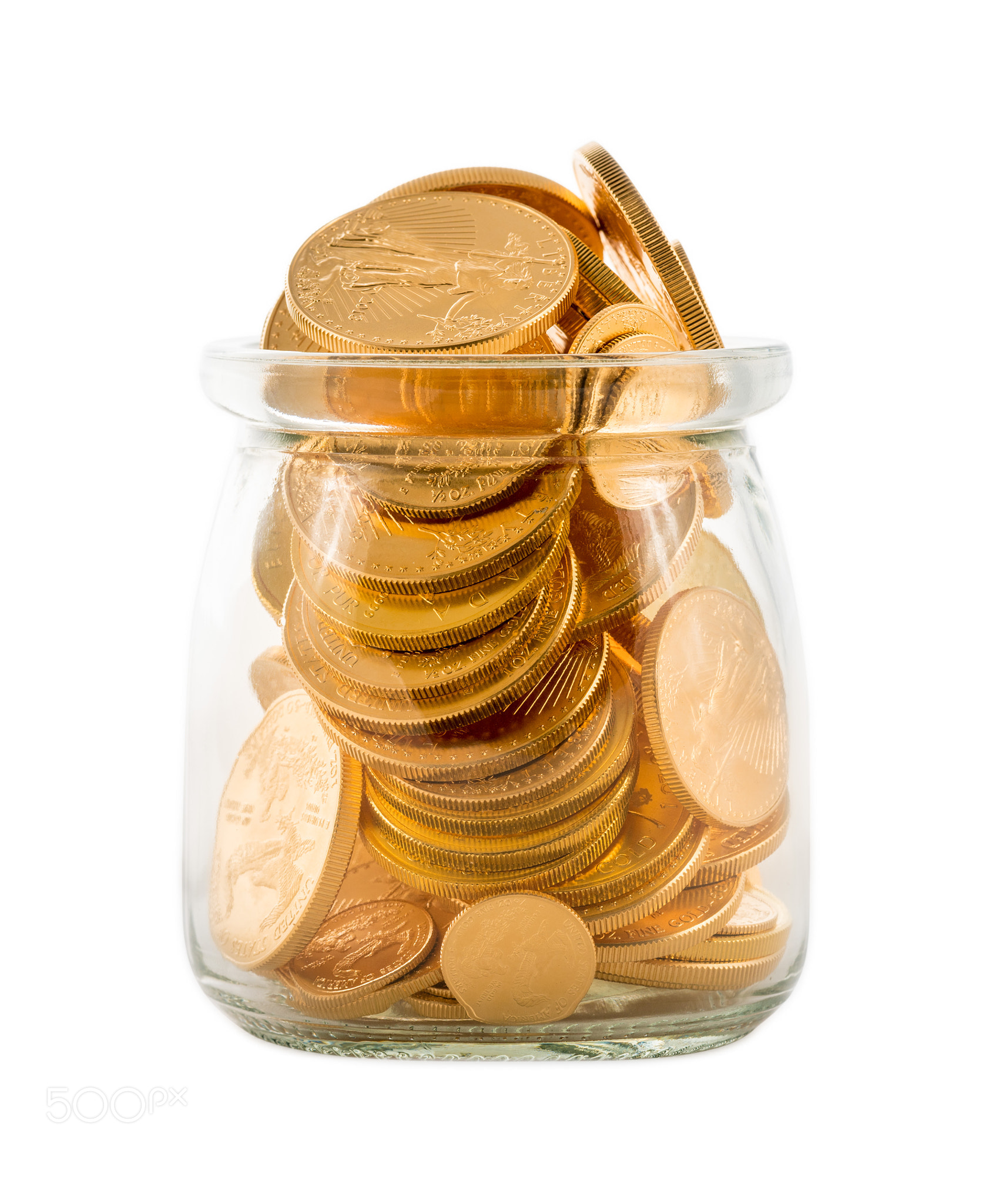 Gold coins inside glass jar to represent savings or investments