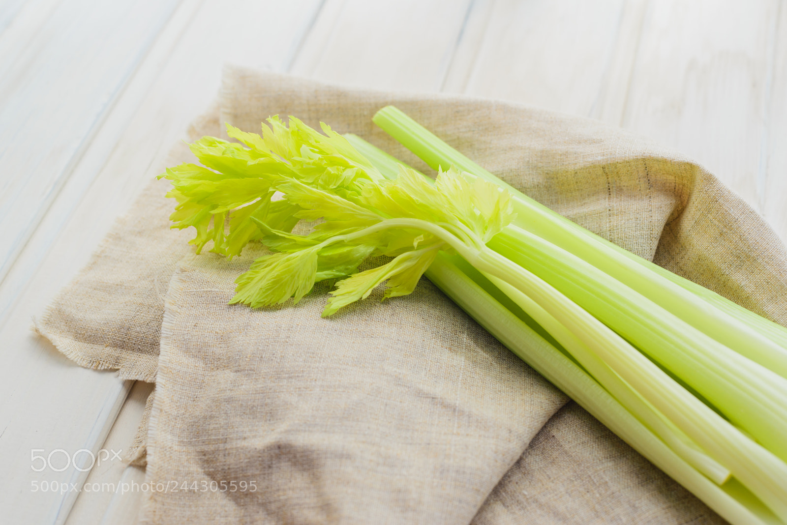 Nikon D600 sample photo. Celery on wooden background photography