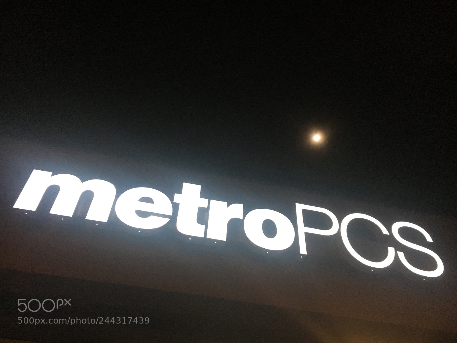 Apple iPhone 6s sample photo. Metropcs in the nightlight photography