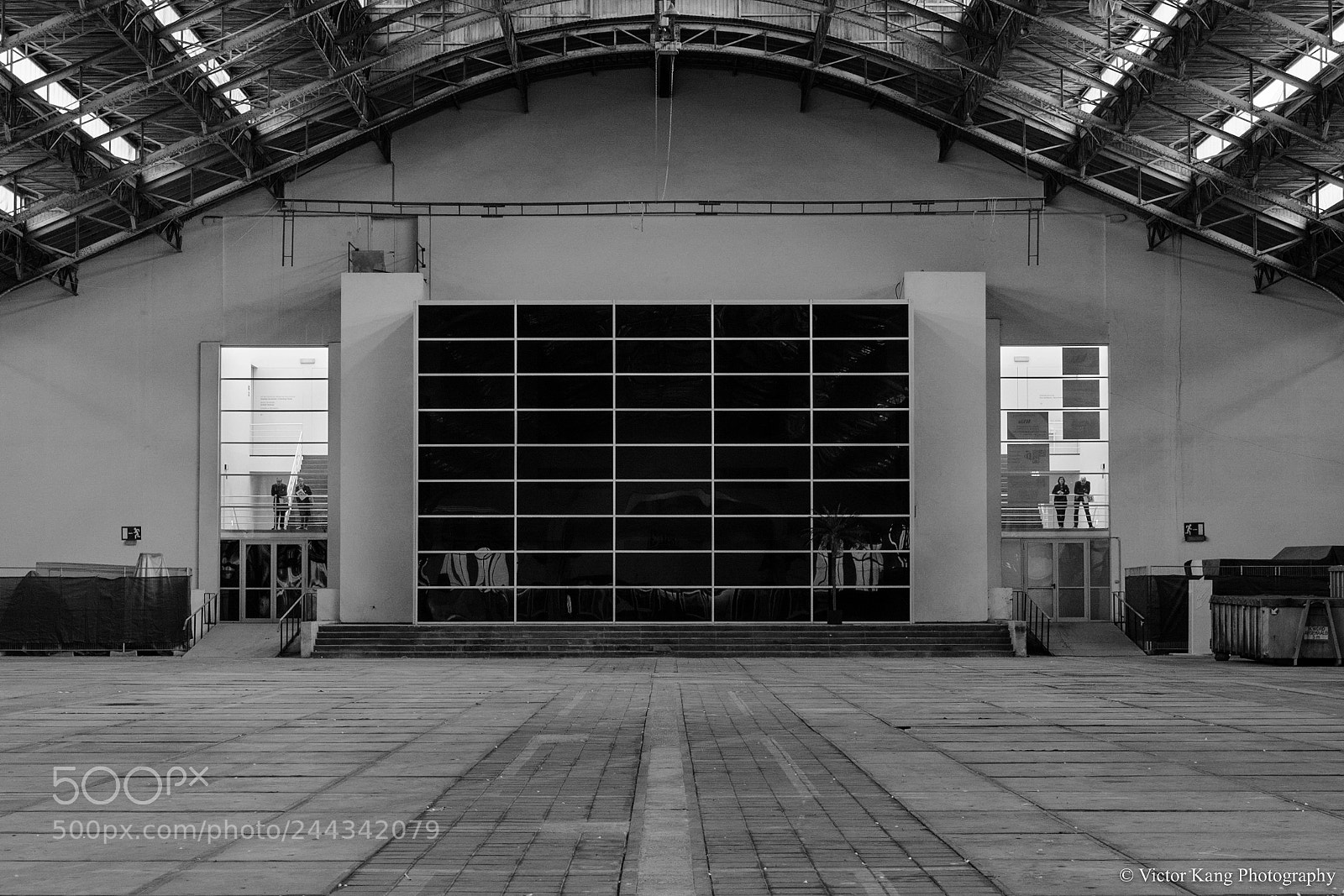 Nikon D7100 sample photo. Figures in a warehouse photography