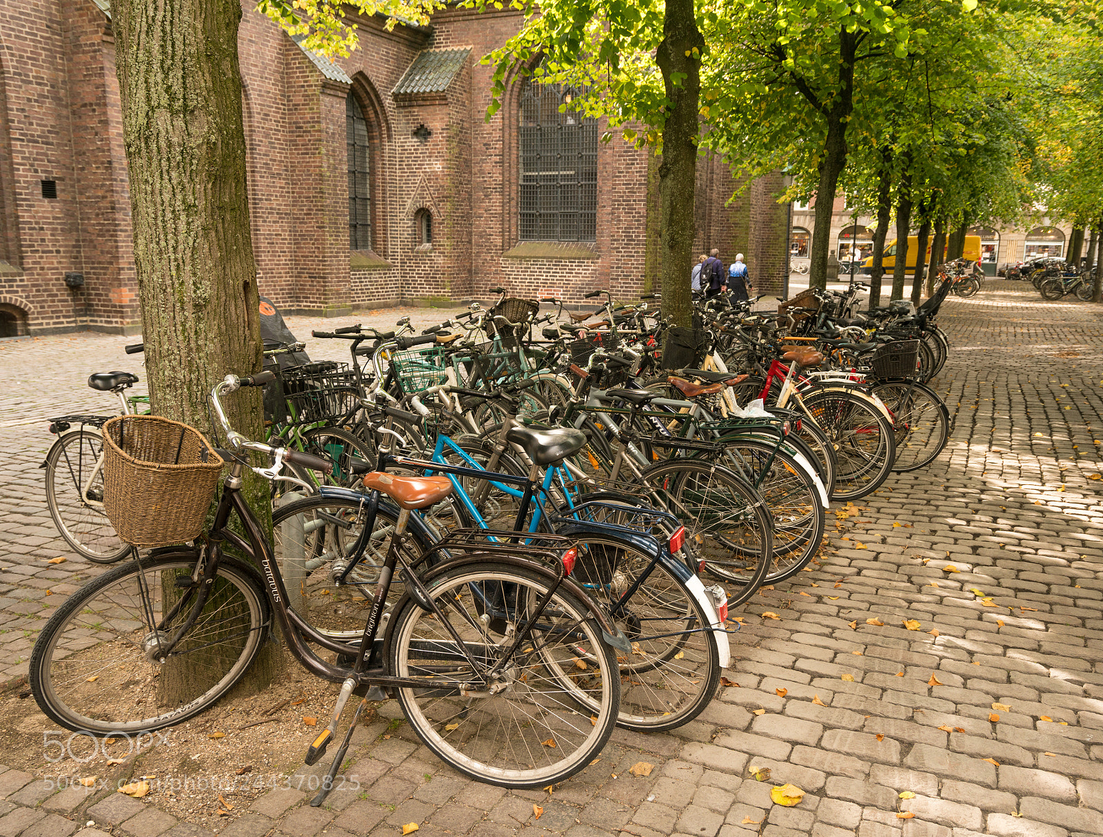 Sony a7R II sample photo. Bikes piled on churchyard photography