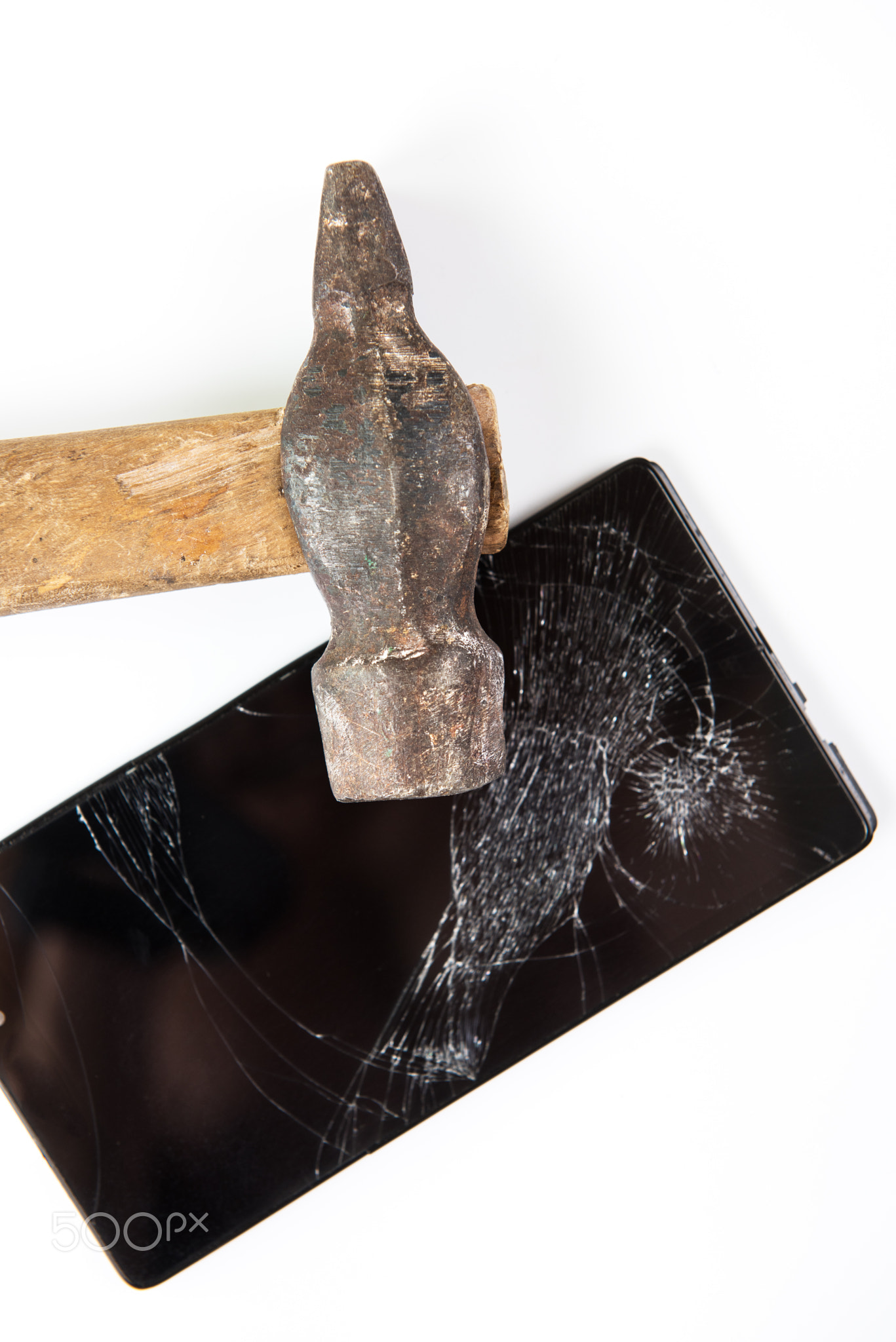 An old hammer and smartphone