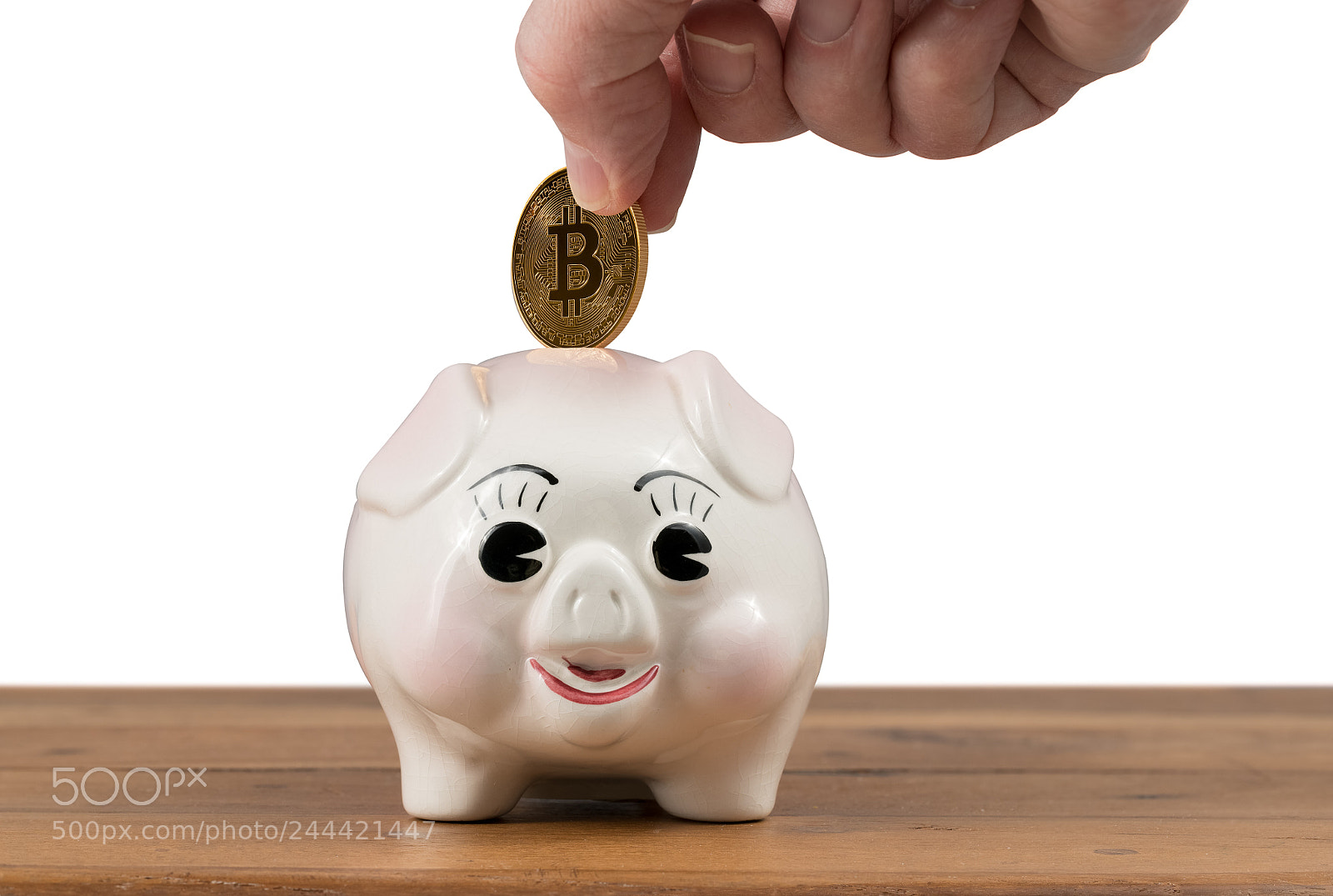 Sony a7R II sample photo. Gold coin being inserted photography