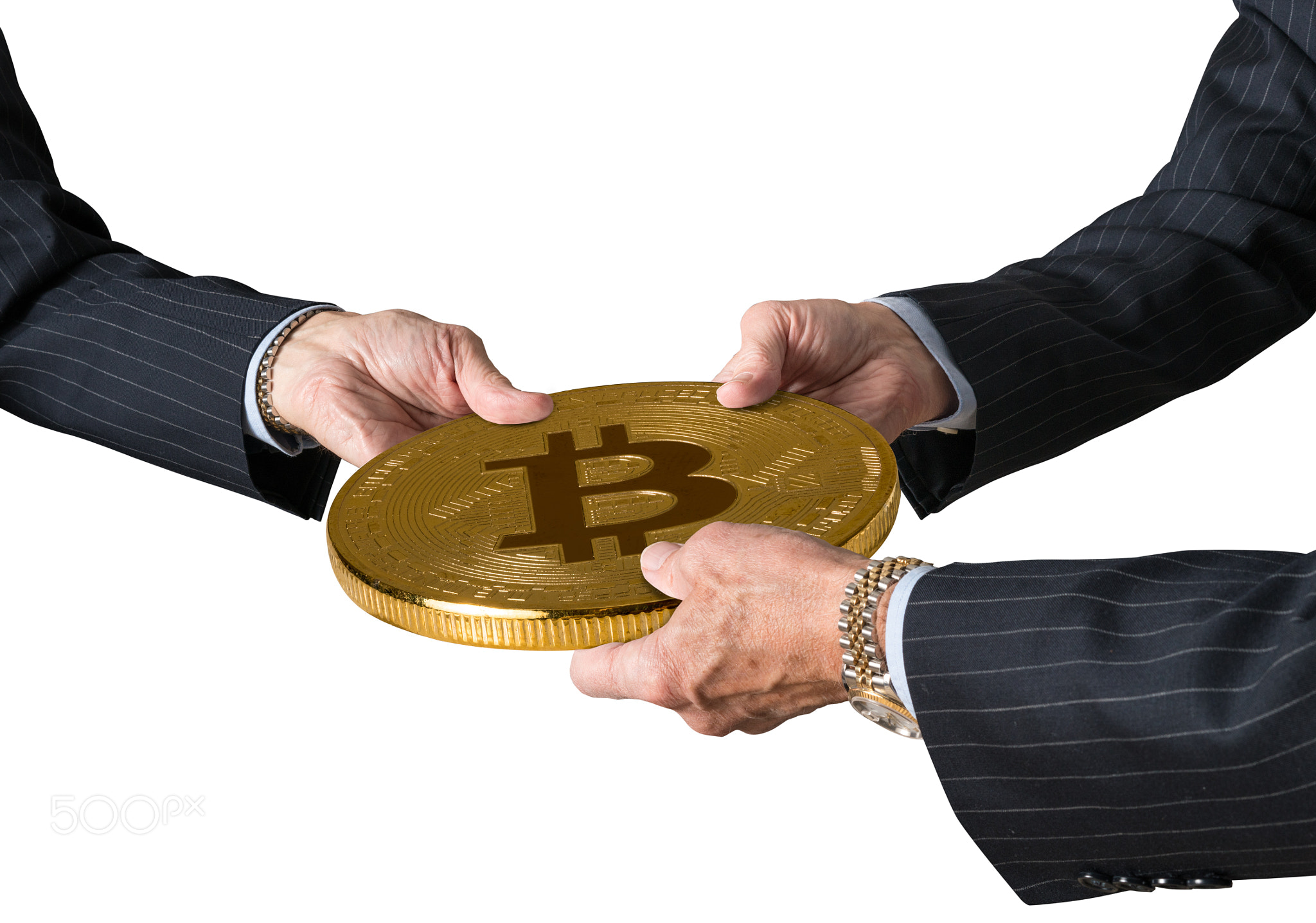 Three traders hands holding large bitcoin