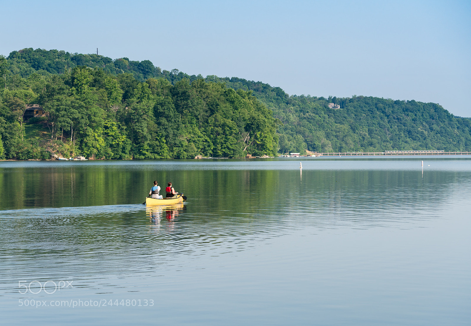 Sony a7R II sample photo. Couple paddling in yellow photography