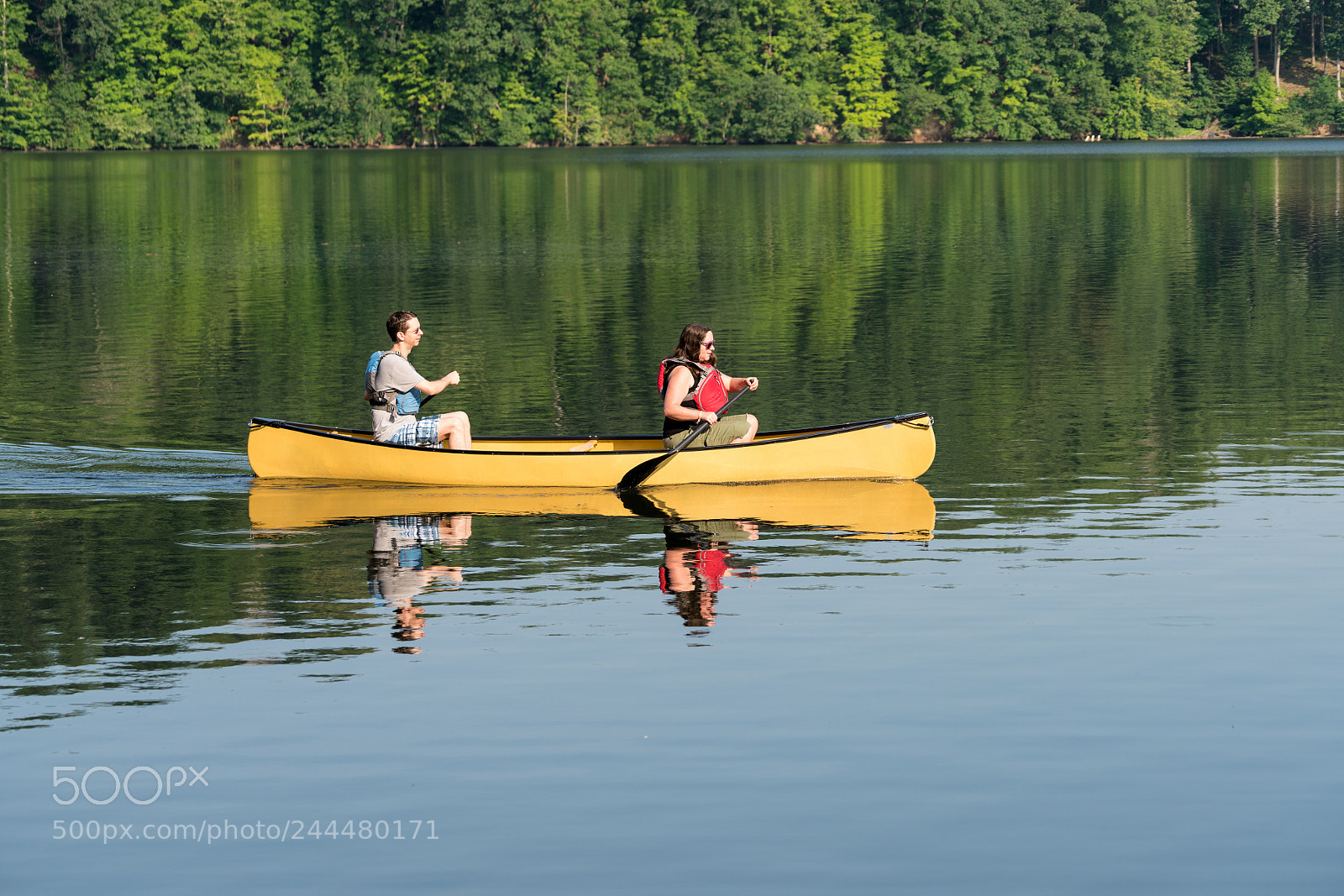 Sony a7R II sample photo. Couple paddling in yellow photography